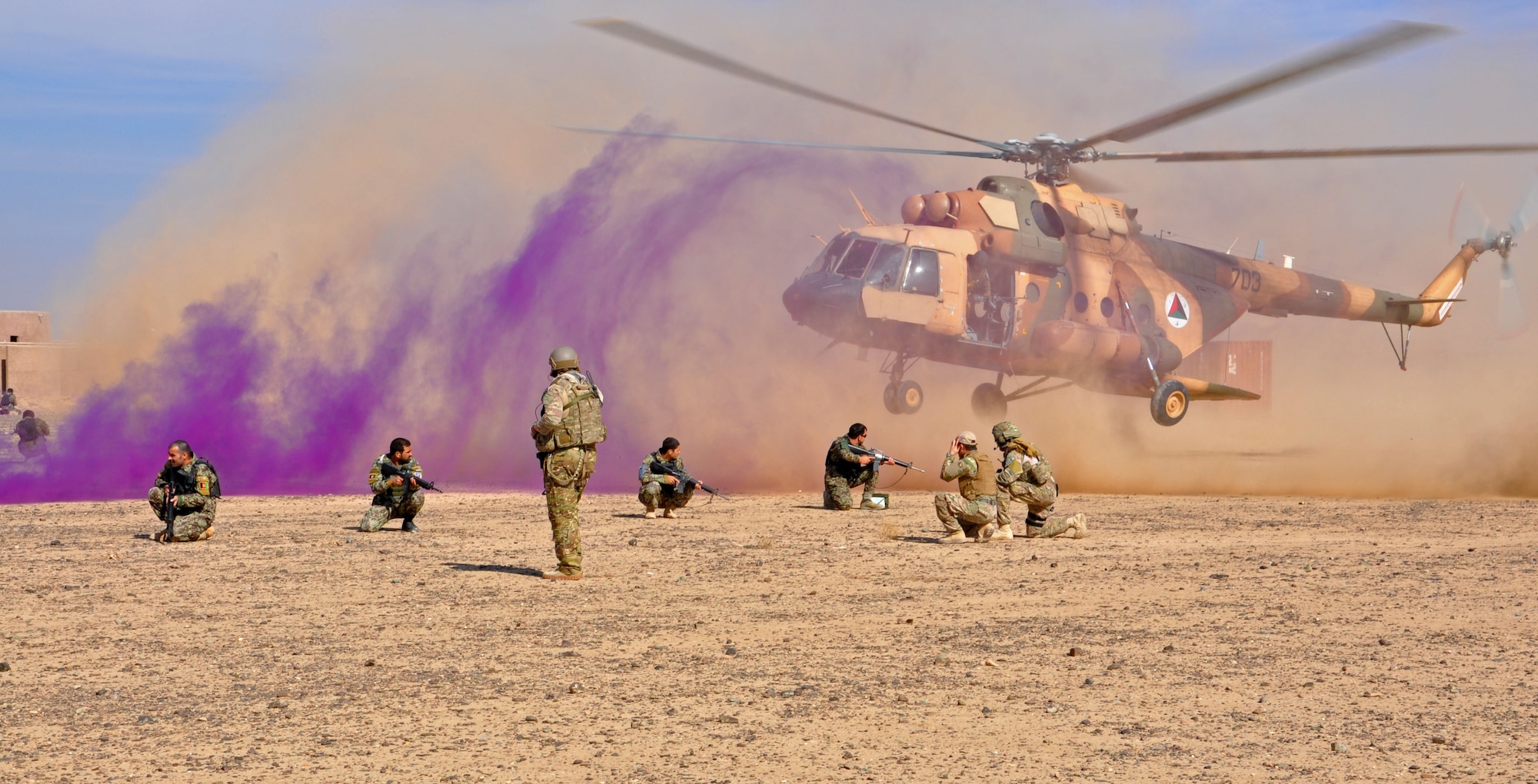 An Afghan Air Force Mi-17 helicopter lands as part of an air assault exercise with members of the Kandahar Air Wing Security Forces Kandak Nov. 10, 2013 near Kandahar Airfield, Afghanistan. Members of the kandak conducted fly away training with NATO Air Training Command-Afghanistan advisors from the 443rd and 441st Air Expeditionary Advisory Squadrons. The 18-person class was taught the basics of air assault, including infiltration and exfiltration, unloading and loading from an aircraft and how to secure an aircraft. (U.S. Air Force photo/Capt. Anastasia Wasem)
