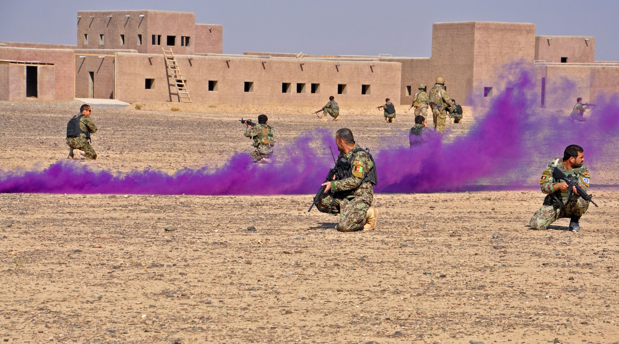 Kandahar Air Wing Security Forces members position themselves as they prepare for a Mi-17 helicopter exfiltration drill as part of an air assault exercise Nov. 10, 2013 near Kandahar Airfield, Afghanistan. The 18-person class conducted fly away security training and was taught the basics of air assault, including infiltration and exfiltration, unloading and loading from an aircraft and how to secure an aircraft. (U.S. Air Force photo/Capt. Anastasia Wasem)