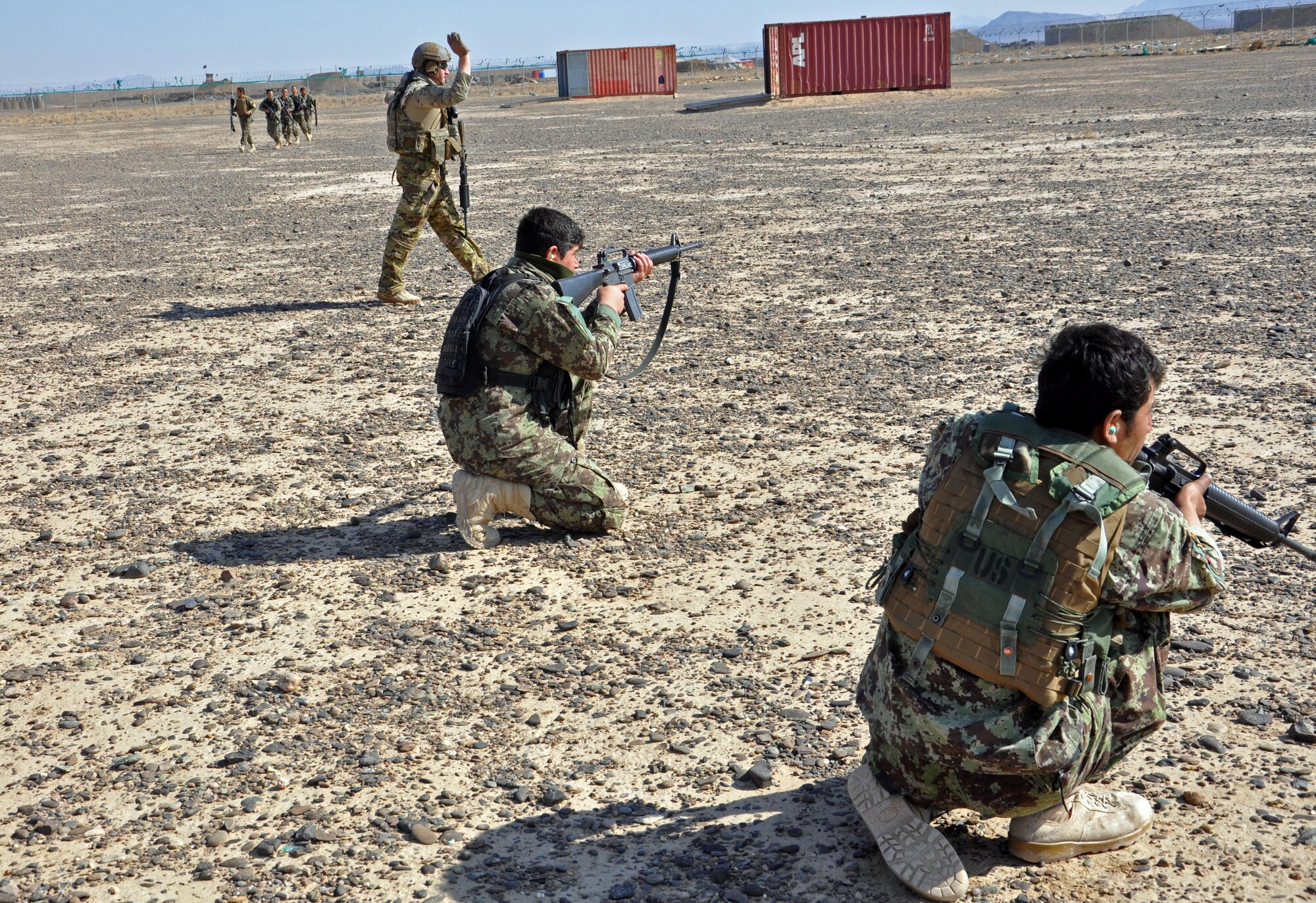 Advisors with NATO Air Training Command-Afghanistan train Afghan Air Force security forces members to set up security after unloading from a Mi-17 helicopter Nov. 10, 2013 near Kandahar Airfield, Afghanistan. The 18-person class conducted fly away security training and was taught the basics of air assault, including infiltration and exfiltration, unloading and loading from an aircraft and how to secure an aircraft. (U.S. Air Force photo/Capt. Anastasia Wasem)