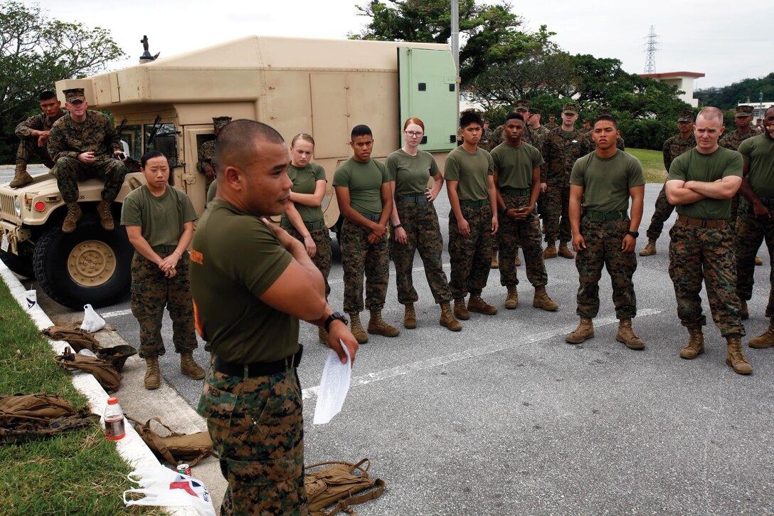 Staff Sgt. Duane C. Pineda explains the rules and regulations during the 3rd Medical Battalion grappling tournament Nov. 15 at Camp Foster. Marines and sailors with the battalion participated in the event to improve unit camaraderie and promote the Marine Corps Martial Arts Program within the unit. Pineda is a martial arts instructor and water support technician with the battalion.