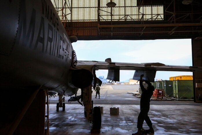 Lance Cpl. Phillip Sousa, an air frame mechanic with Marine Tactical Electronic Warfare Squadron 2, works on a wing of an EA-6B Prowler aboard Marine Corps Air Station Iwakuni, Japan, Nov. 25, 2013. The EA-6B Prowler is a twin-engine, mid wing electronic warfare aircraft and was commissioned as an aircraft of the U.S. Armed Forces in 1971.