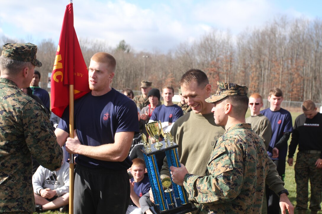 John Lang, a Marine Corps poolee from Proctorville, Ohio, and U.S. Marine Corps Staff Sgt. Matthew Rogers, the staff noncommissioned officer in charge of Recruiting Sub-Station Huntington and a Trafford, Pa. native, accept the first place award for top sub-station during Recruiting Station Charleston’s Statewide Pool Meet in Beckley, W.Va. Nov. 23, 2013. The award was presented by U.S. Marine Corps Maj. Gabriel Diana, the commanding officer of RS Charleston, and U.S. Marine Corps Sgt. Maj. Dennis Bradley, the sergeant major of RS Charleston. (U.S. Marine Corps photo by Sgt. Tyler J. Hlavac/Released)