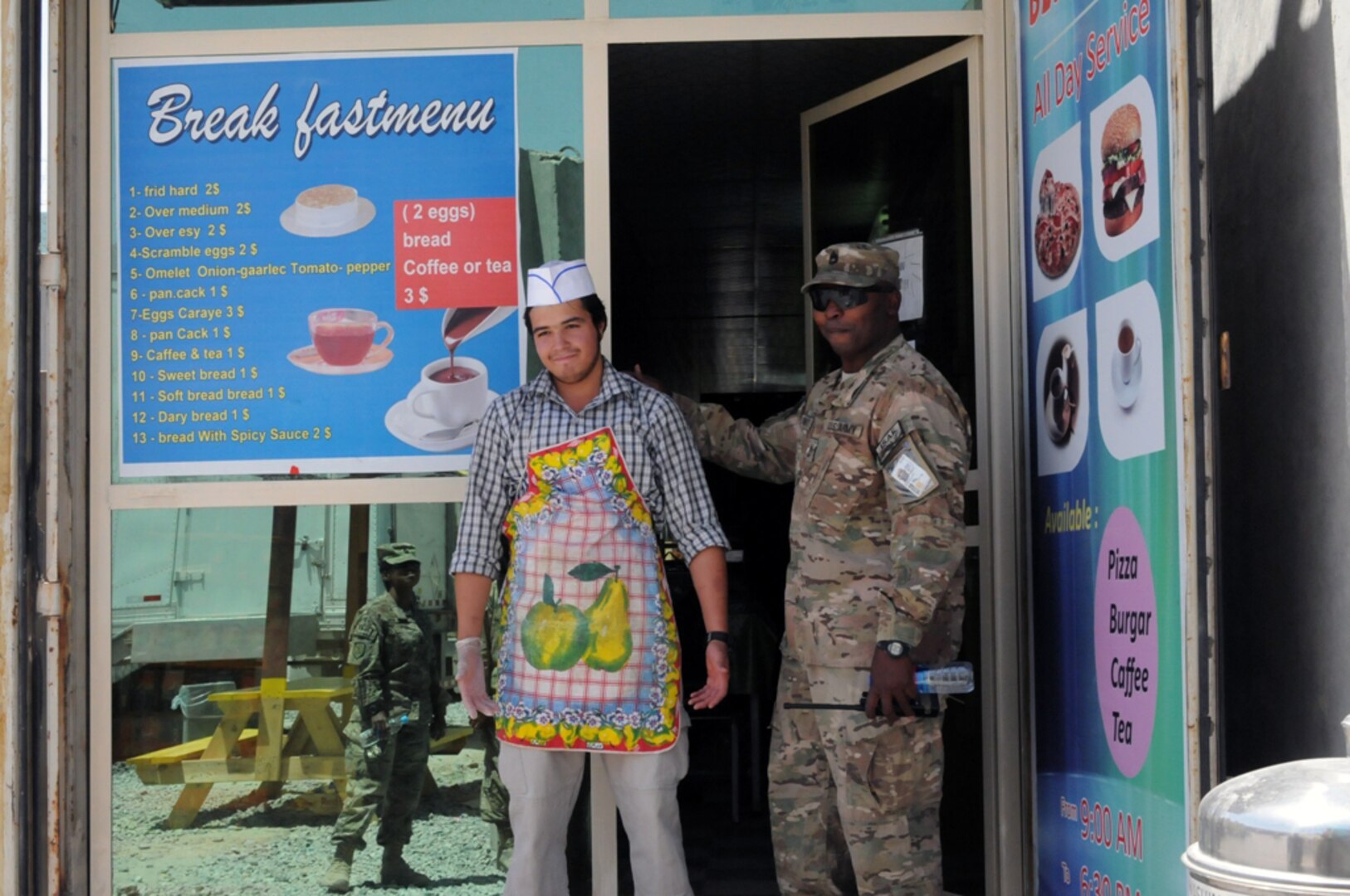 Army Sgt. 1st Class Maurice E. Stewart, the noncommissioned officer in charge of Camp Black Horse stops by one of the locally run stores on camp to make sure that everything is going ok.