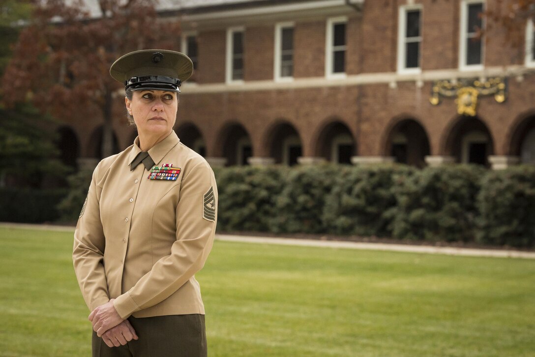 Sgt. Maj. Angela M. Maness, Marine Barracks Washington, D.C. sergeant major, stands on the parade deck prior to the commencement of a Navy Meritorious Unit Commendation presentation at the Barracks Nov. 22. The Barracks earned the award for its performance while in support of multiple major events around the national capital region. 