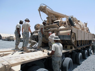 Members of the Michigan National Guard's 1462nd Transportation Company recently trained Soldiers from 3rd Infantry Division and Tennessee Army National Guard’s 230th Engineer Battalion, on the M1070 Heavy Equipment Transporter, or HET, during an eight-day, 80-hour course held at Camp Arifjan.