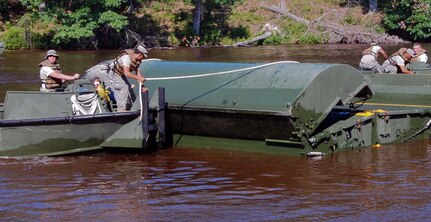 Soldiers with the Virginia Army National Guard's 189th Multi-Role Bridge Company conduct river crossing operations with the Improved Ribbon Bridge system at Fort A.P. Hill, Va.