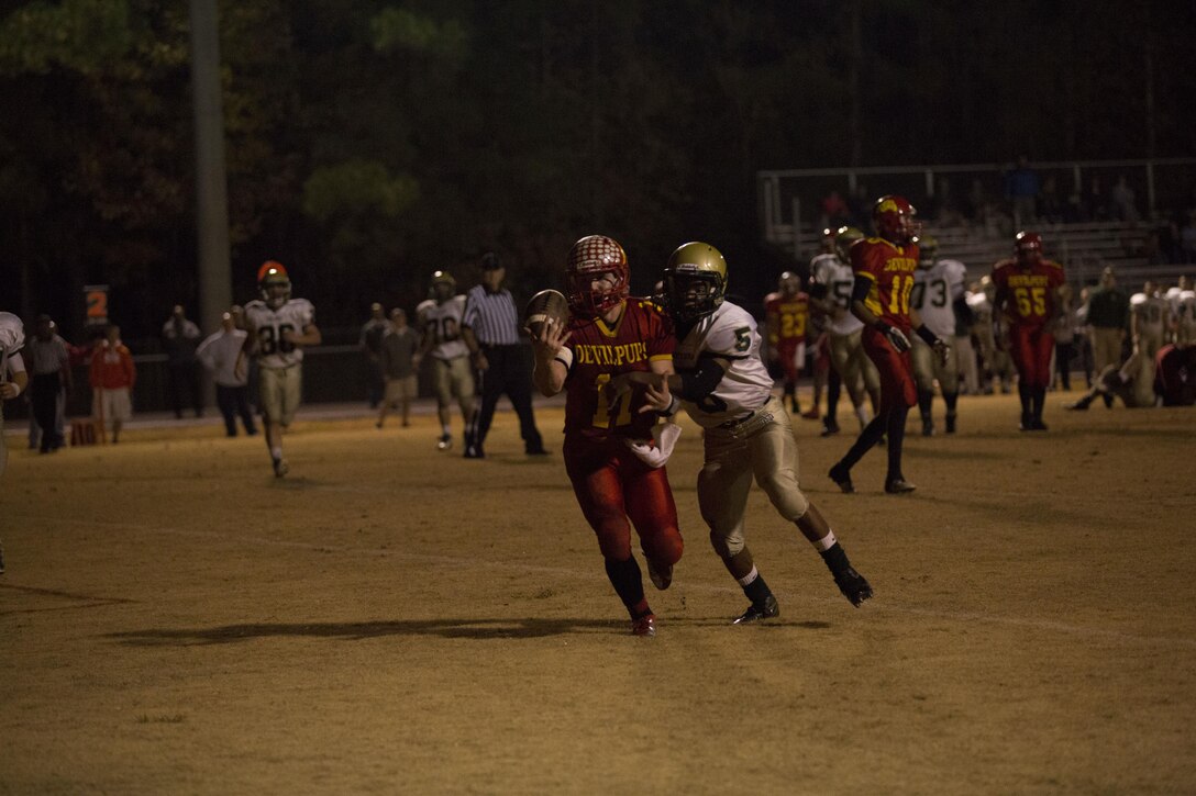 Brady Bodine, wide receiver for the Lejeune Bulldogs, catches a pass at the second round of the North Carolina High School Athletic Association playoffs aboard Marine Corps Base Camp Lejeune, Nov. 22. Bodine completed six catches for 54 yards during the game.