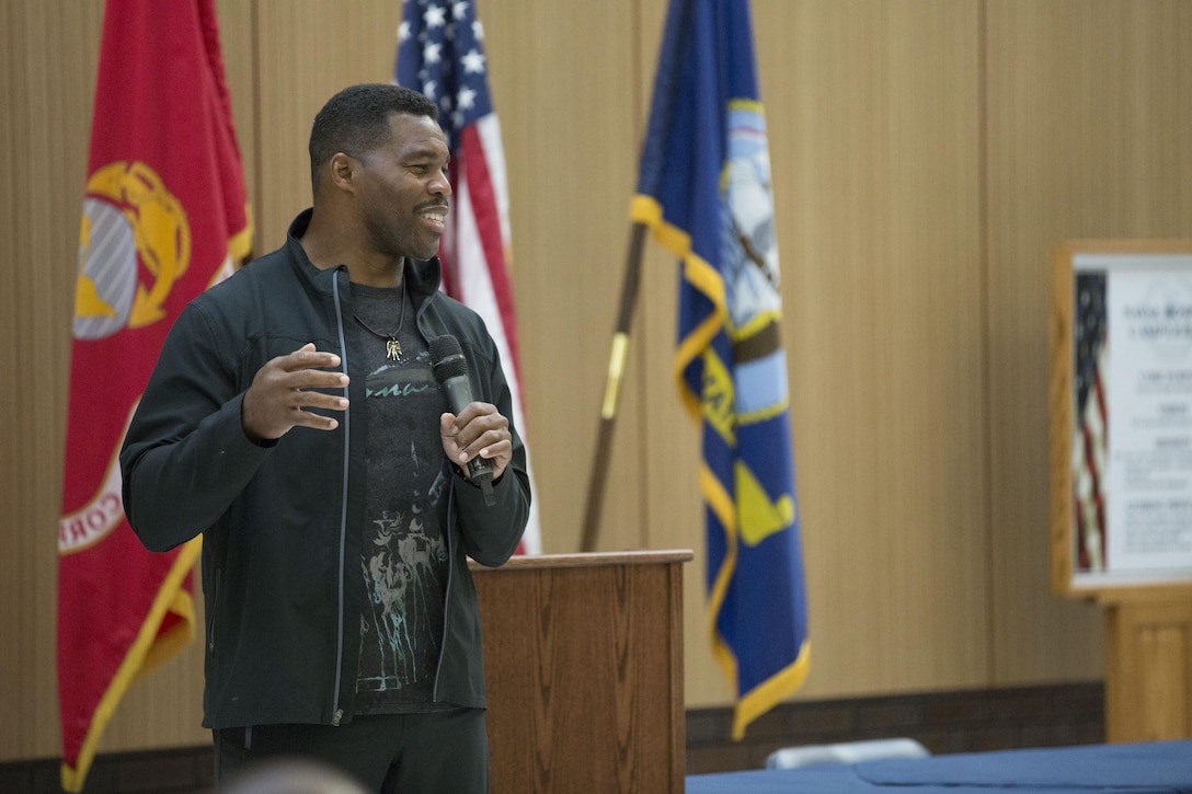 Herschel Walker, retired National Football League player and mixed martial artist, speaks to Marines and sailors at Naval Hospital Camp Lejeune aboard Marine Corps Base Camp Lejeune, Nov. 25.