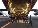 Active-duty Airmen from the 517th Airlift Squadron and Alaska Air Guard members from the 249th Squadron are currently serving in Operation Damayan, storm relief work in the Philippines. Photo shows some of the refugees transported to safety.