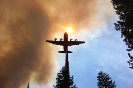 A California Air National Guard C-130J Hercules, equipped with a Modular Airborne Firefighting System, drops retardant on a wildfire near Twin Falls, Idaho, Aug. 8, 2012. The 146th Airlift Wing currently has two C-130Js and about 30 personnel who have been activated since June 30, 2012, to assist the U.S. Forest Service fighting fires in the Northwest and other parts of the country.