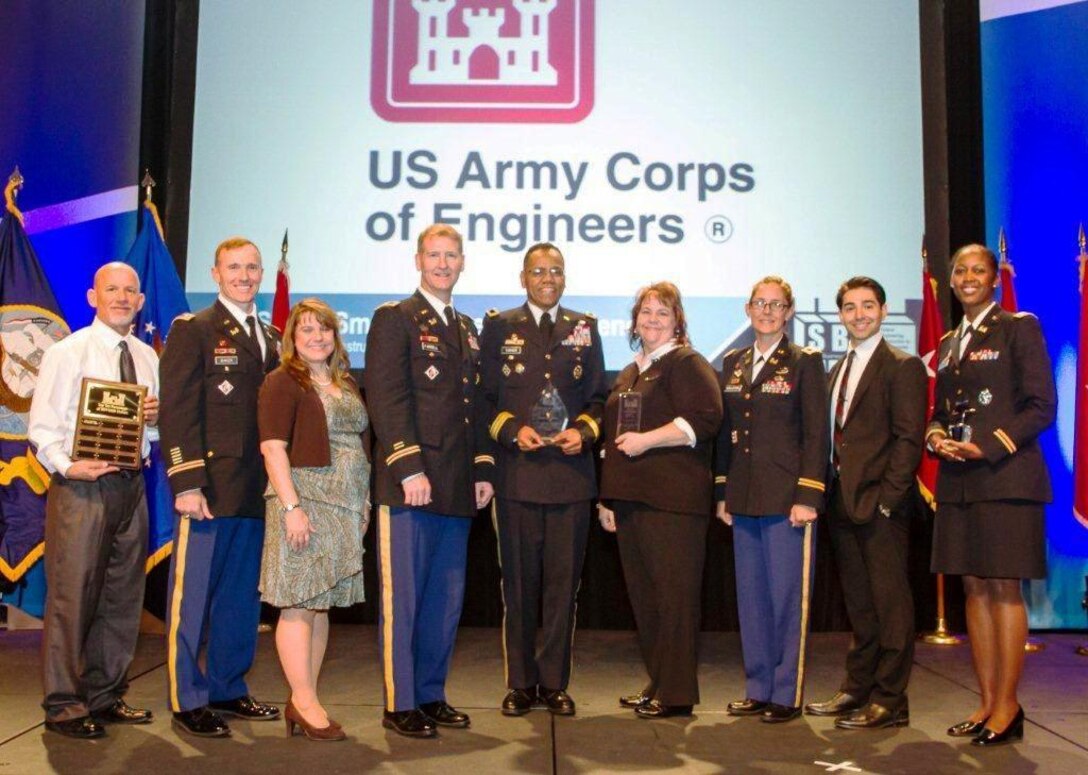 South Pacific Division, which Albuquerque District is a part, was recognized for many achievements in its small business programs.
(l-r): Rick Vredenburg, small business program, South Pacific Division; Lt. Col. John Baker, Commander, San Francisco District; Michelle Stratton, small business deputy, Sacramento District; Col. Michael Farrell, Commander Sacramento District; Brig. Gen. C. David Turner, Commander, South Pacific Division; Melea Crouse, small business program, Southwestern Division; Col. Kimberly Colloton, Commander Los Angeles District; Tom Koponen, contract specialist, Sacramento District; Lt. Col. Antoinette Gant, Commander Albuquerque District.