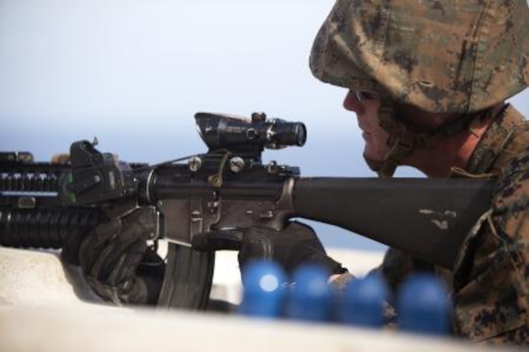 Lance Cpl. Micah Hutson, a rifleman with 3rd Battalion, 3rd Marine Regiment, shoots an M203 grenade launcher with a recently developed sight as part of new equipment testing at Kaneohe Bay range training facility, Nov. 19.
