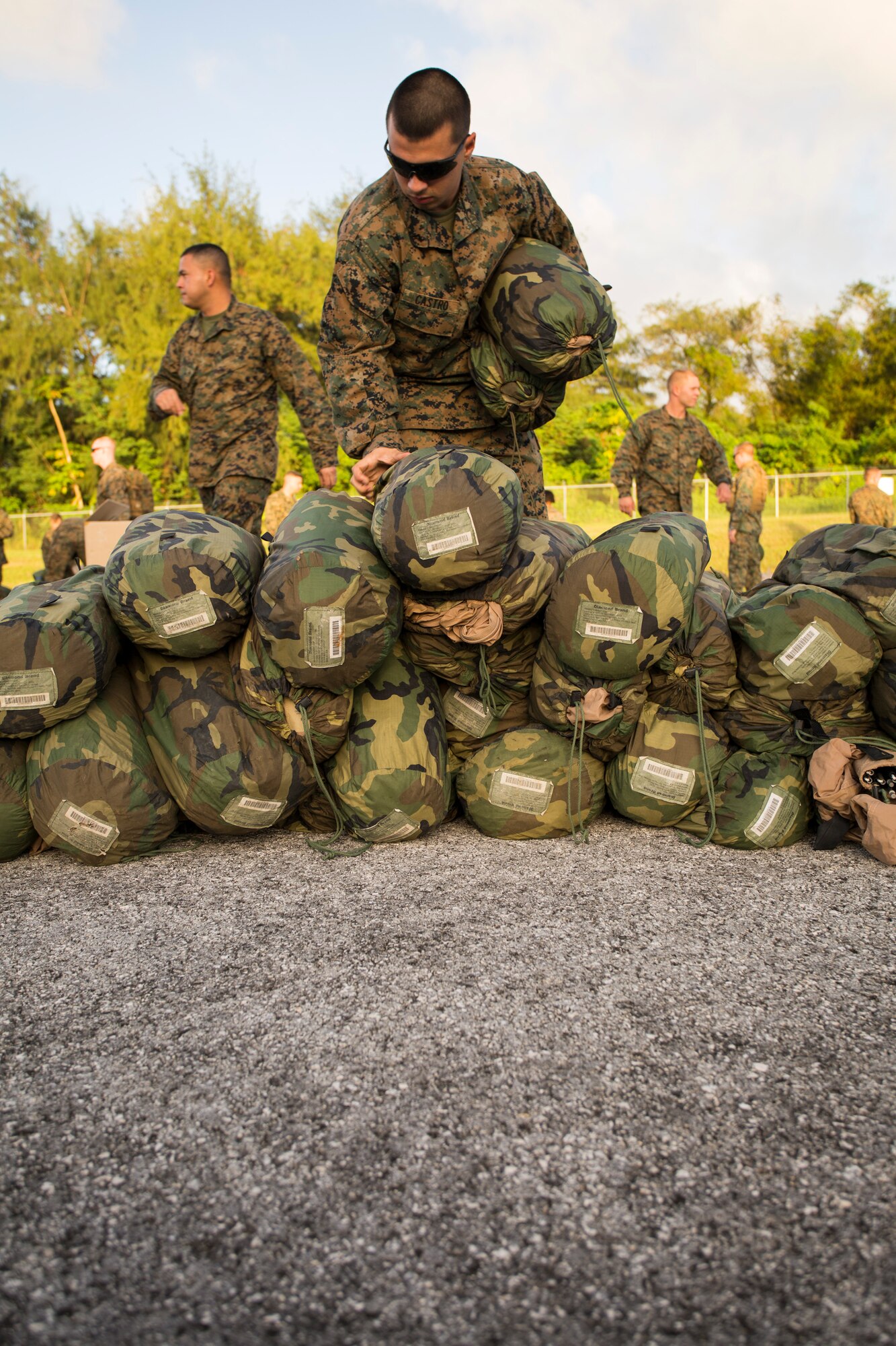 U.S. Marines unload cargo at Tinian’s International airport Nov. 6, 2013, during the opening stages of exercise Forager Fury II. Airmen from the 734th Air Mobility Squadron on Andersen Air Force Base, Guam, supported the Marines by facilitating an estimate of 1,200 passenger movements and loading 200 pallets during the exercise. (U.S. Marine Corps photo by Lance Cpl. Antonio Rubio/Released)