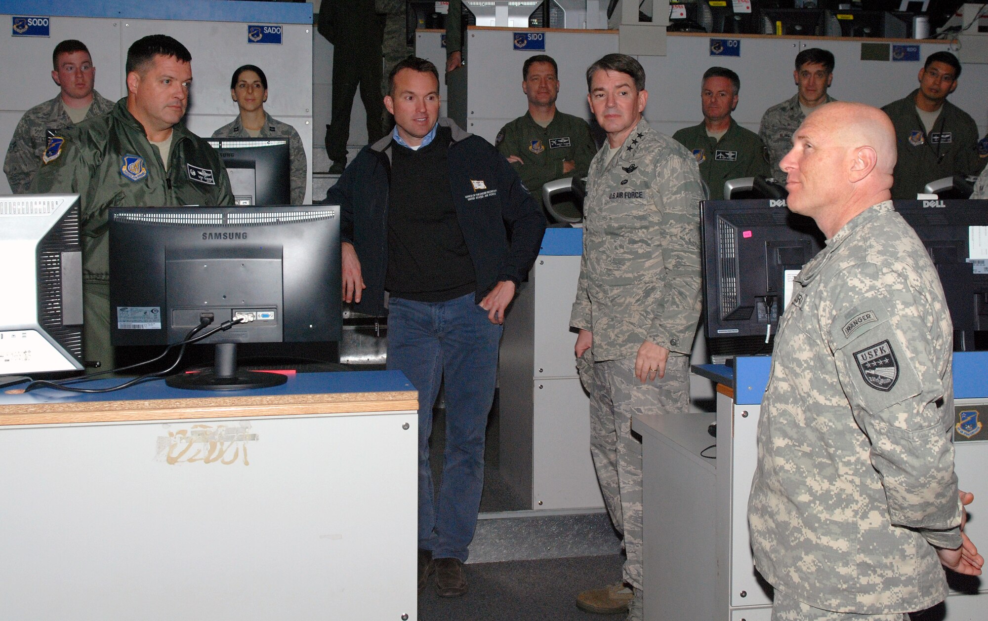 OSAN AIR BASE, Republic of Korea - Acting Secretary of the Air Force Eric Fanning receives a brief on the Army's role in the 607th Air and Space Operations Center mission by Army Col. Joseph Gleichenhaus, 3rd Battlefield Coordination Detachment - Korea commander, during a familiarization visit to 7th Air Force and Osan Air Base Nov. 25. During his first visit to the Korean Peninsula, Fanning was was shown how elements from every U.S. service branch worked alongside Republic of Korea military units to ensure peace and stability on the Korean Peninsula. (U.S. Air Force photo by Tech. Sgt. Thomas J. Doscher)