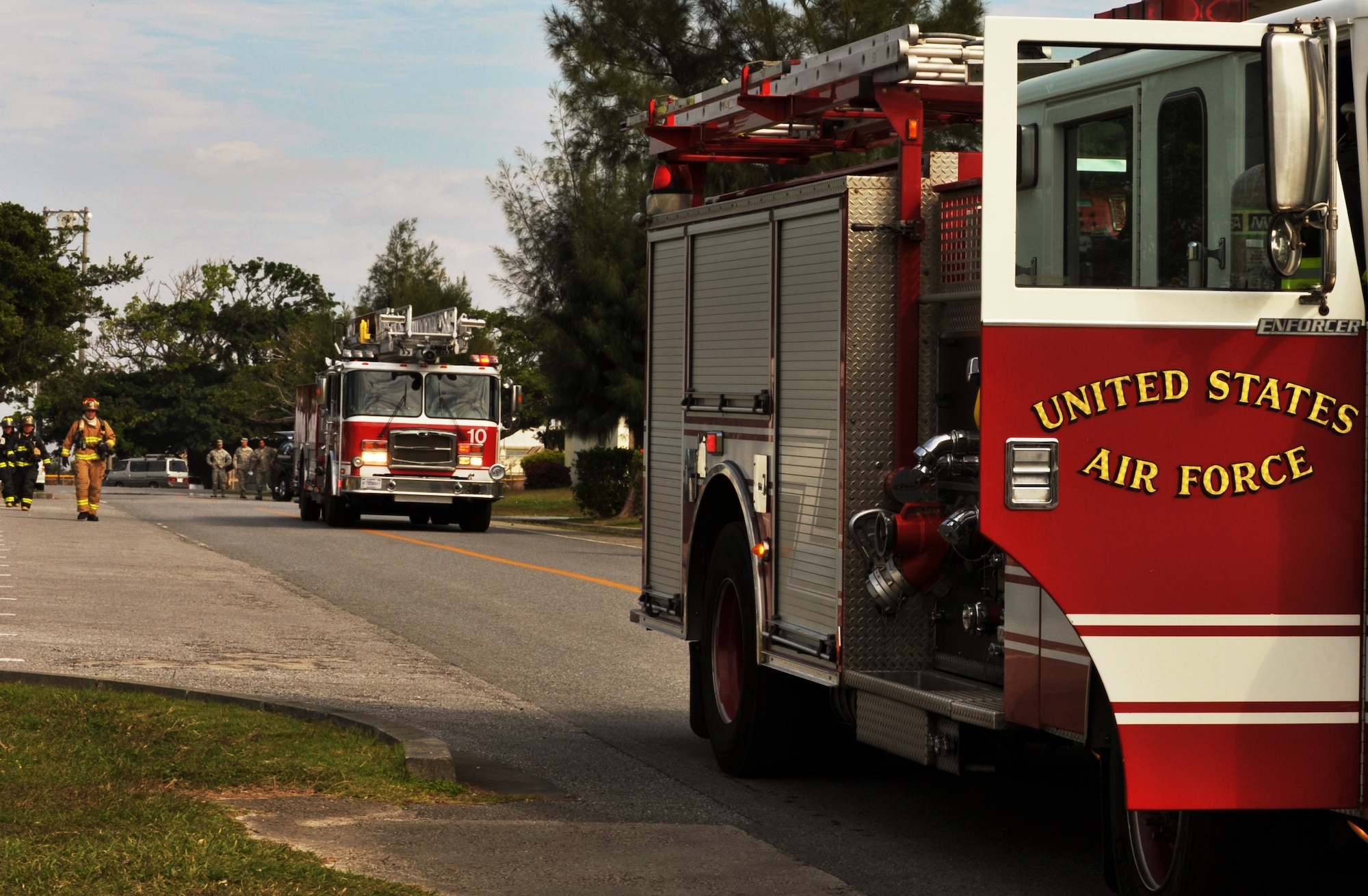 Kadena Fire trucks arrive at the scene of a simulated explosion during the emergency management exercise at Marek Park on Kadena Air Base, Japan, Nov. 21, 2013. The exercise is conducted at least once a year. (U.S. Air Force photo by Naoto Anazawa)