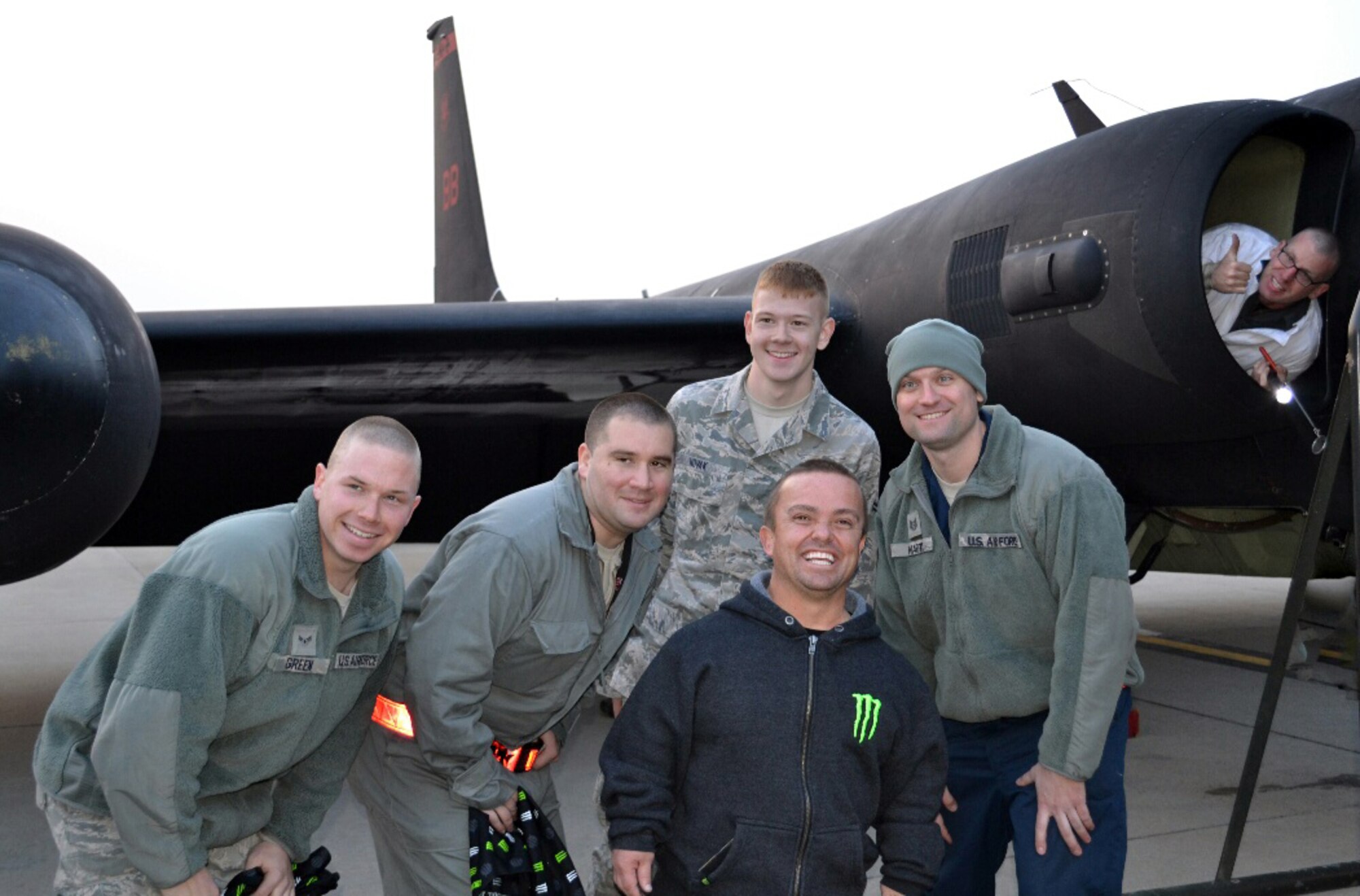 Jason “Wee-Man” Acuña, professional skateboarder and MTV star, poses for a photo with members of the 5th Reconnaissance Squadron at Osan Air Base, Republic of Korea, Nov. 23, 2013. During his visit to the 5th RS, Wee-Man rode in a “chase car” during a U-2 Dragon Lady landing, toured a static display of the aircraft and signed autographs for 5th RS members. (Courtesy photo/Maj. Gary Charland)