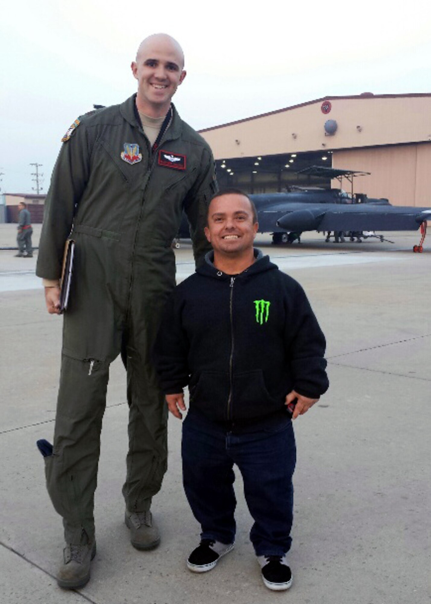 Jason “Wee-Man” Acuña, professional skateboarder and MTV star, poses for a photo with Maj. Matthew (last name withheld due to operational security constraints), 5th Reconnaissance Squadron U-2 Dragon Lady pilot, at Osan Air Base, Republic of Korea, Nov. 23, 2013. Wee-Man visited Osan as part of a Monster energy drink tour, and between autograph sessions at the base Exchange, visited the 5th RS. (Courtesy photo/Maj. Gary Charland)