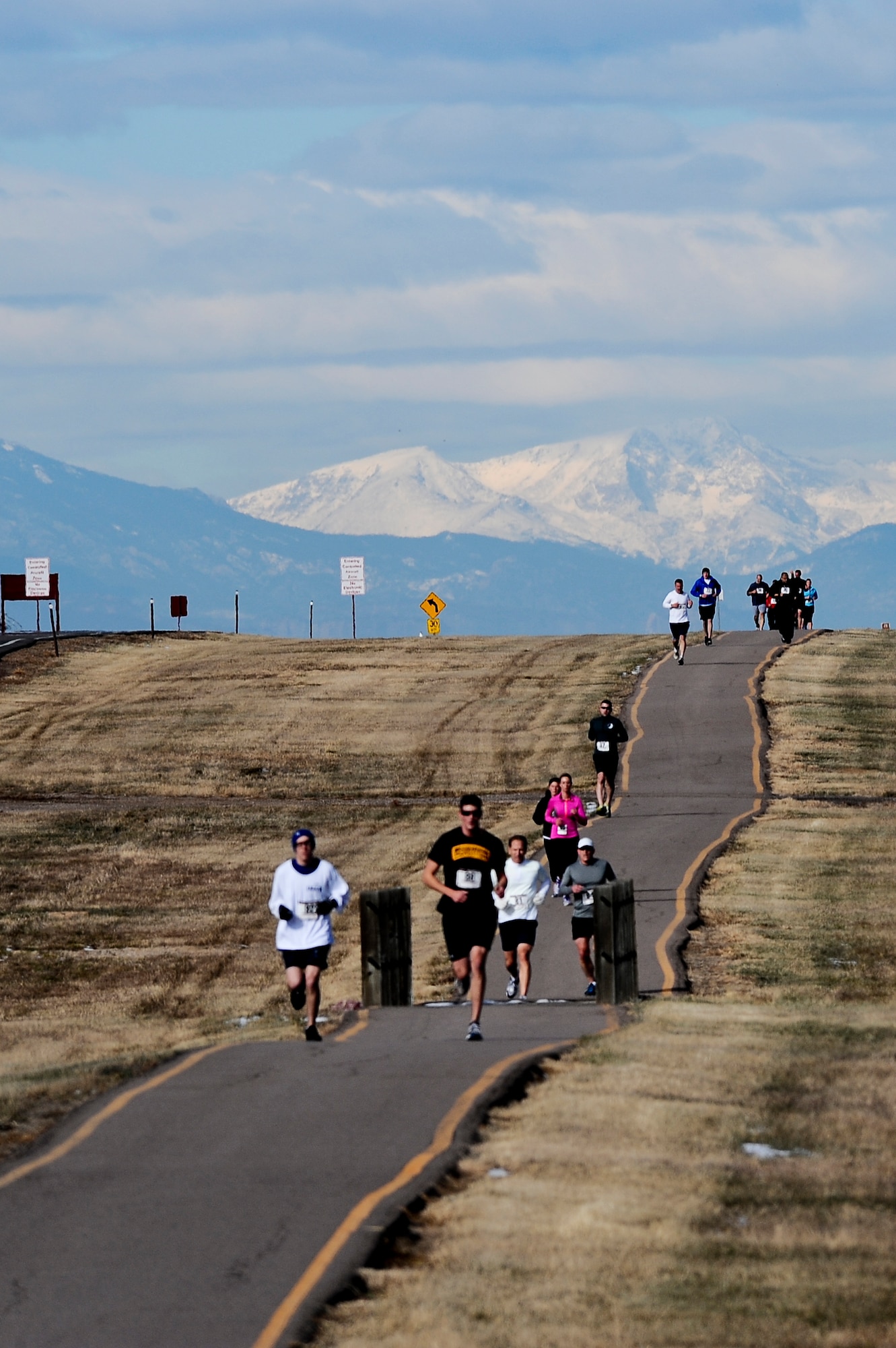 Runners compete during the 9th Annual Turkey Trot 5K race Nov. 26, 2013, on Buckley Air Force Base, Colo. The fastest runners in each category were given turkeys as prizes. (U.S. Air Force photo by Senior Airman Phillip Houk/Released)