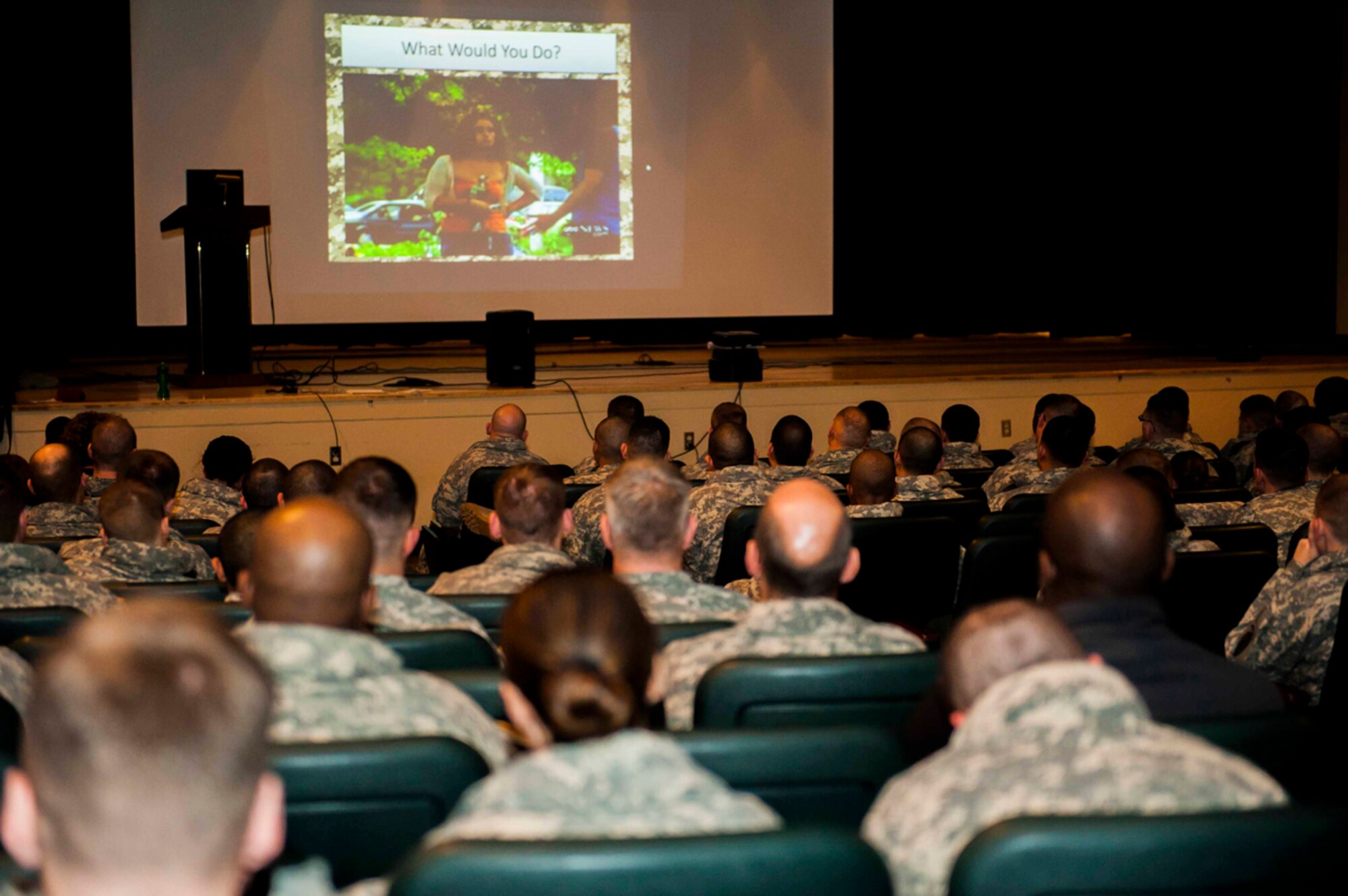 Soldiers watch a video during bystander intervention training at Joint Base Elmendorf-Richardson Post Theater on Nov. 19. The training gave Soldiers options on how to approach a sexual assault, domestic violence or child abuse situation to intervene. Soldiers and Airmen are required to have this training annually. (U.S. Air Force photo/Airman 1st Class Tammie Ramsouer)