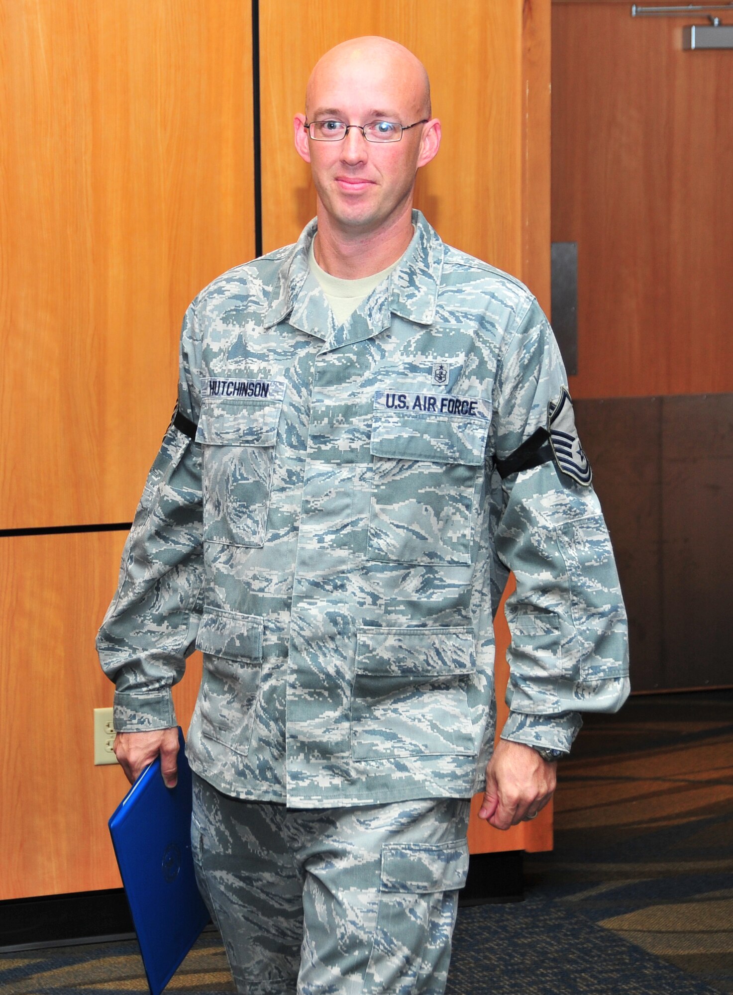 Sergeant Craig Hutchinson, 325th Medical Operations Squadron Maternal Child Flight Chief, stands-by to shake hands with guest at the December promotion ceremony Nov. 26 at the Horizons community center. Hutchinson was selected for Stripes for Exceptional Performers promotion from technical sergeant to master sergeant. (U.S. Air Force photo by Airman 1st Class Sergio Gamboa)