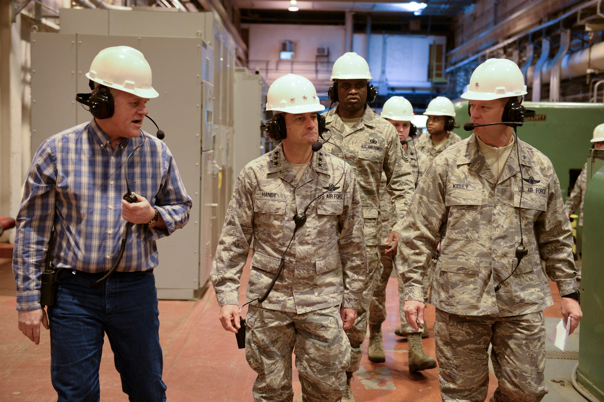 U.S. Air Force Lt. Gen. Russell Handy, 11th Air Force commander, Chief Master Sgt. Jerry Moore Jr., 11th Air Force command chief, and Brig. Gen. Mark Kelly, 354th Fighter Wing commander, tour the Central Heat and Power Plant with Marty Overlin, 354th Civil Engineer Squadron central heat and power plant superintendent, Eielson Air Force Base, Alaska, Nov. 21, 2013. Handy and Moore stopped at Eielson to visit the Airmen and familiarize themselves with Eielson's unique operations.  (U.S. Air Force photo by Airman 1st Class Peter Reft/Released)