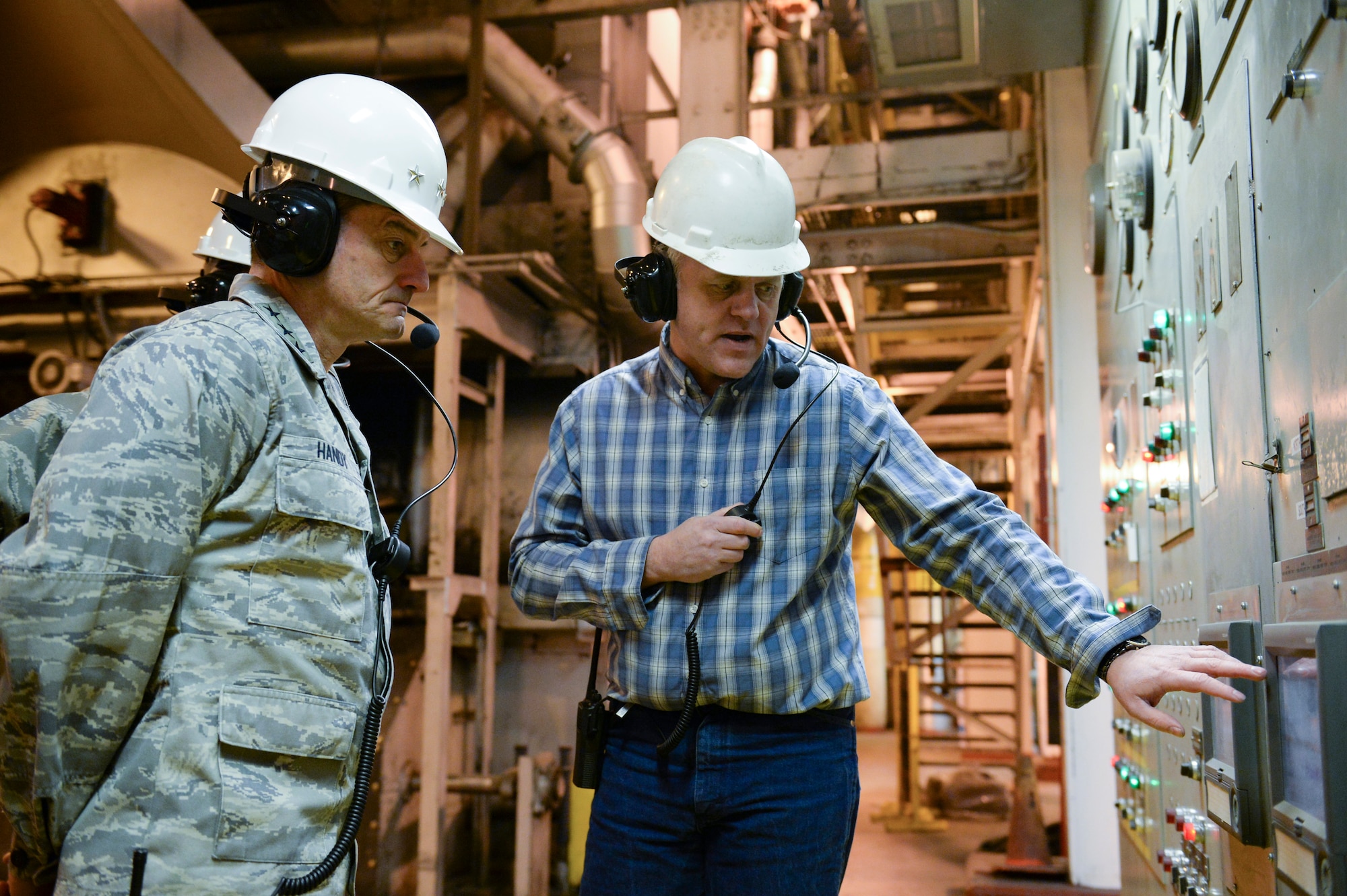 U.S. Air Force Lt. Gen. Russell Handy, 11th Air Force commander, and Marty Overlin, 354th Civil Engineer Squadron central heat and power plant superintendent, examine an instrument panel at the Central Heat and Power Plant Nov. 21, 2013, Eielson Air Force Base, Alaska. Handy assumed command of the 11th AF in August.  (U.S. Air Force photo by Airman 1st Class Peter Reft/Released)