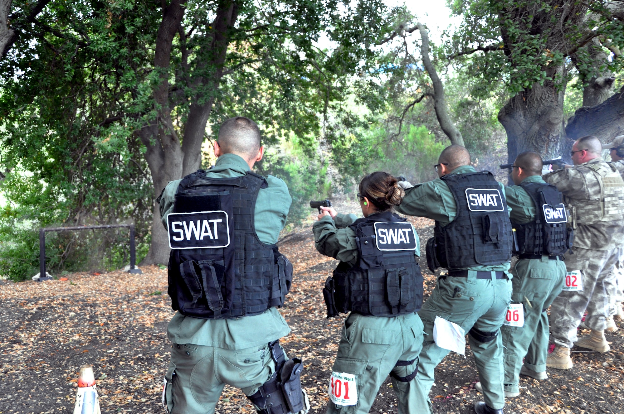 Members of the Travis Emergency Services Team fire at targets in the Jungle Trail course last week in San Jose. The Airmen were competing in the Best in the West SWAT competition against 35 other SWAT teams from the West Coast.(U.S. Air Force photo/Staff Sgt. Patrick Harrower)