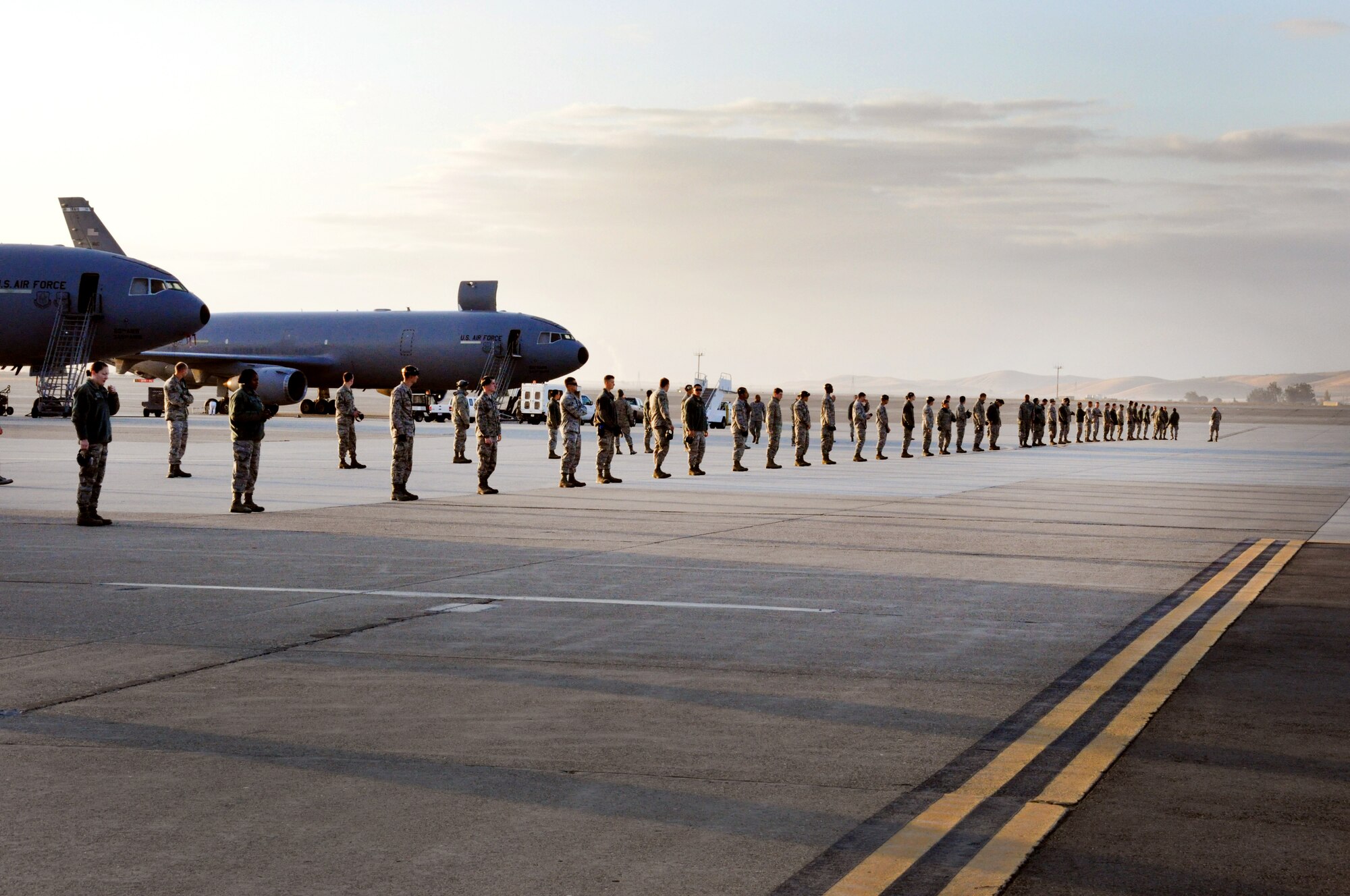 Airmen from the 60th Maintenance Squadron line up for a FOD walk Oct. 29 on the flightline.(U.S. Air Force photo/Staff Sgt. Patrick Harrower)