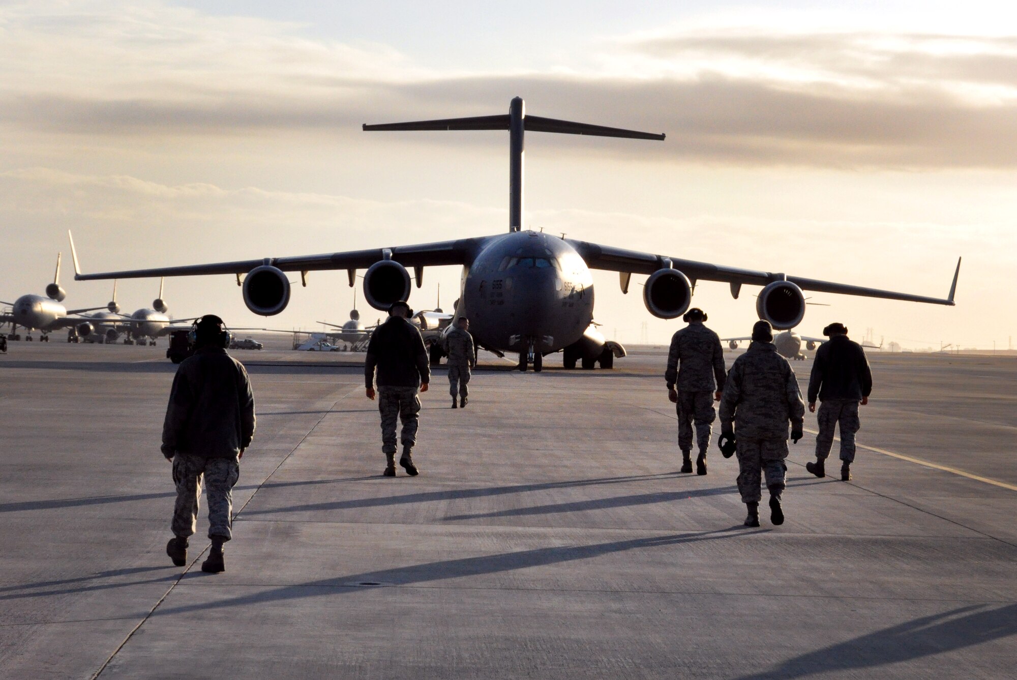 Airmen from the 60th Maintenance Squadron conduct a FOD walk Oct. 29 on the flightline.(U.S. Air Force photo/Staff Sgt. Patrick Harrower)