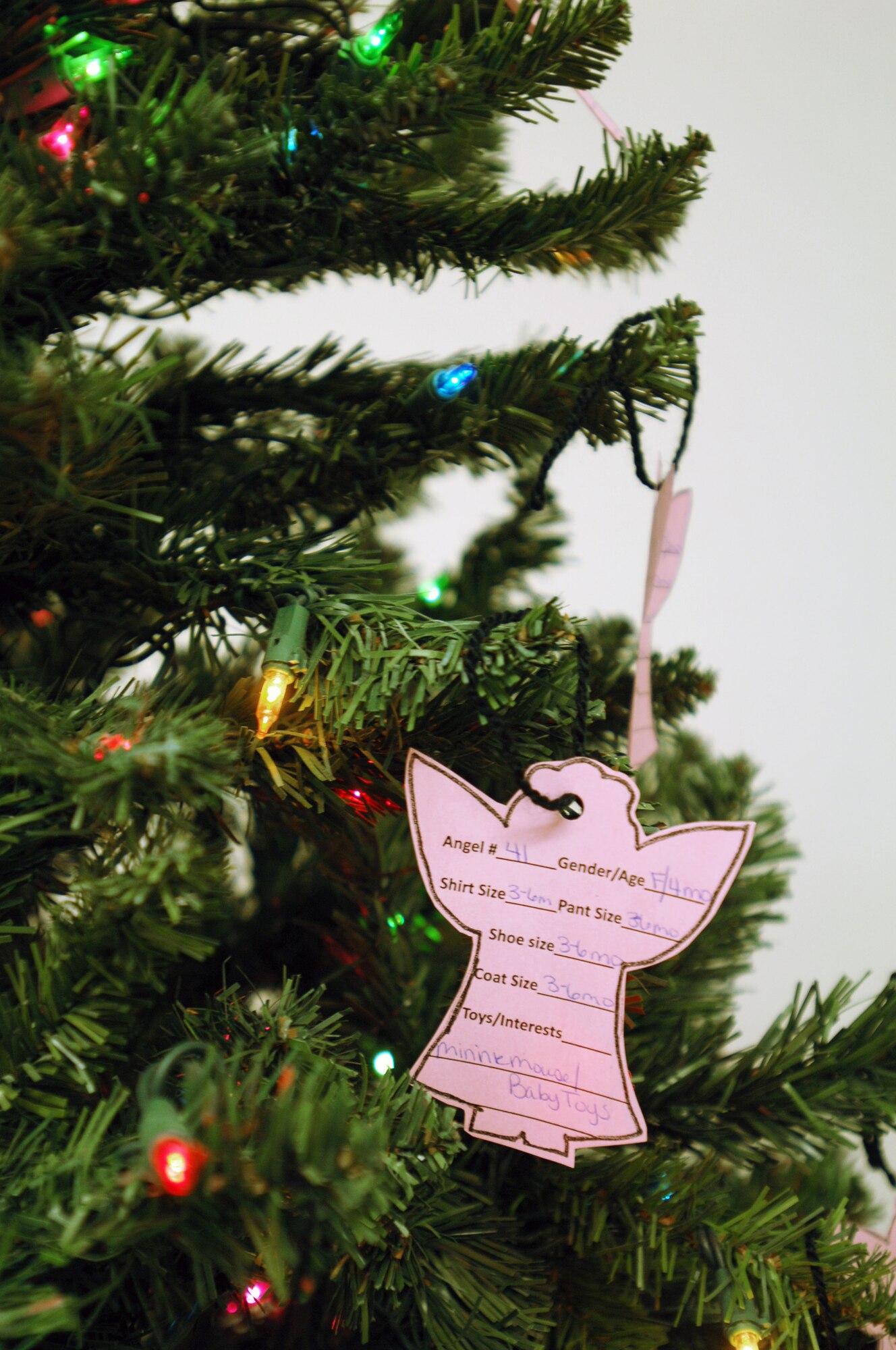 The Cannon Air Force Base Angel Tree decorated with "angels" in need of sponsors for the holidays in the Exchange Dec. 7, 2011, at Cannon Air Force Base, N.M. The tree has been put up for the past several years in an effort to ensure all children within the Cannon community have the best Christmas possible. (U.S. Air Force photo by Senior Airman Jette Carr)