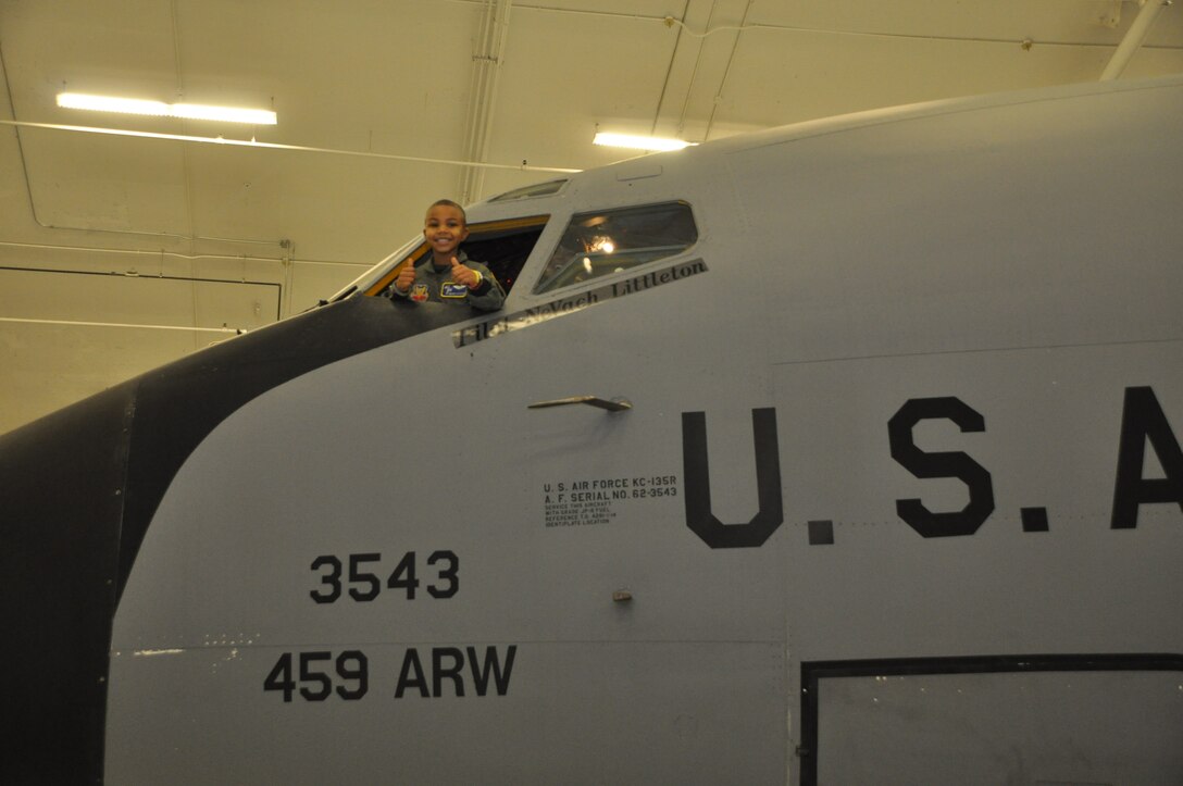 Ne’Veah Littleton sticks his head out of the window of a KC-135 Stratotanker from the 459th Air Refueling Wing, during a day in which Ne’Veah was appointed a pilot for the Pilot for a Day program Joint Base Andrews, Md., November 22, 2013. Ne’Veah is a terminally ill child diagnosed with Diffuse Intrinsic Pontine Glioma, which is a tumor on the brain stem. (U.S. Air Force photo/ Staff Sgt. Katie Spencer)