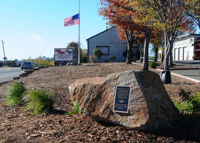 Cal-Fire Butte County Headquarters honors Capt. Randy Roby and Ms. Geraldine Vering with a memorial in front of the fire station in Oroville, Calif., Nov. 22, 2013. The new metal and stone monument replaced a wooden memorial. (U.S. Air Force photo by Senior Airman Allen Pollard/Released)
