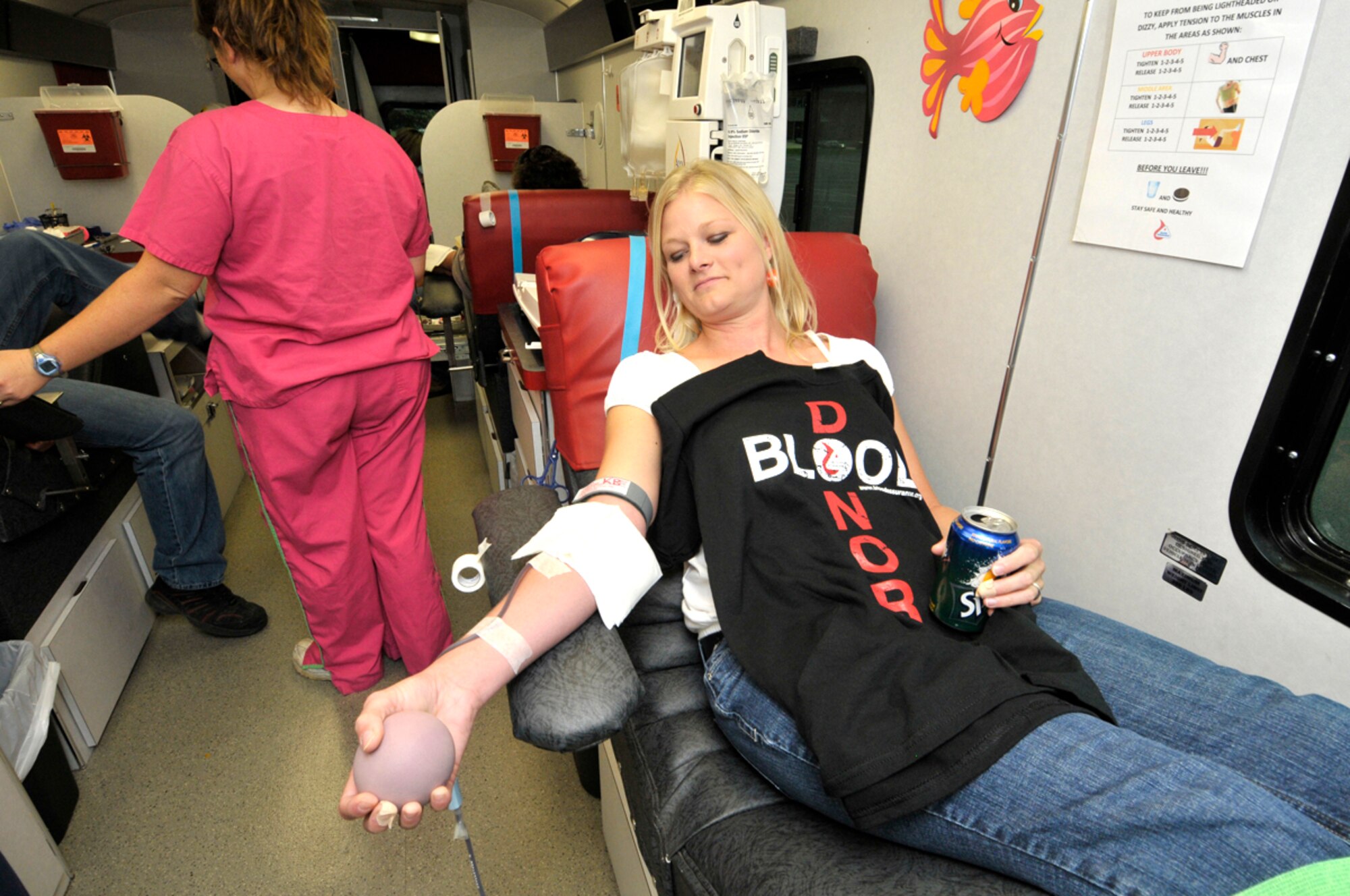Shelly Cowan, system administrator for MIRATEK, donates blood during a Blood Assurance bloodmobile visit to AEDC. (Photo by Rick Goodfriend)
