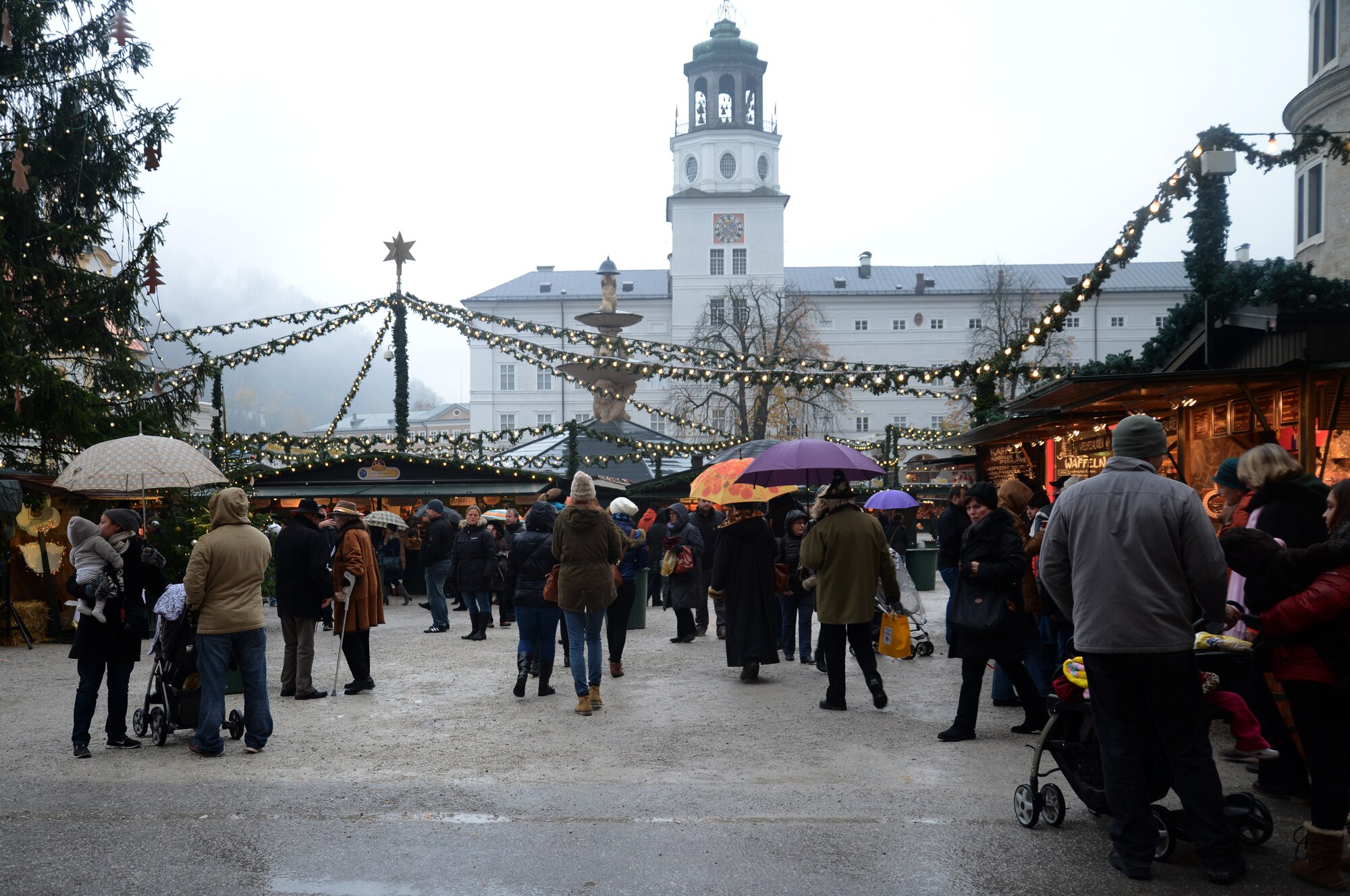 Transcendent Christmas lights flicker upon an assortment of holiday cheer, Nov. 22, 2013, at a Christmas market in Salzburg, Austria. During the advent season, there are numerous Christmas markets found in the city known for the musical, “Sound of Music.” (U.S. Air Force photo/1st Lt. Lacie Jo Collins) 