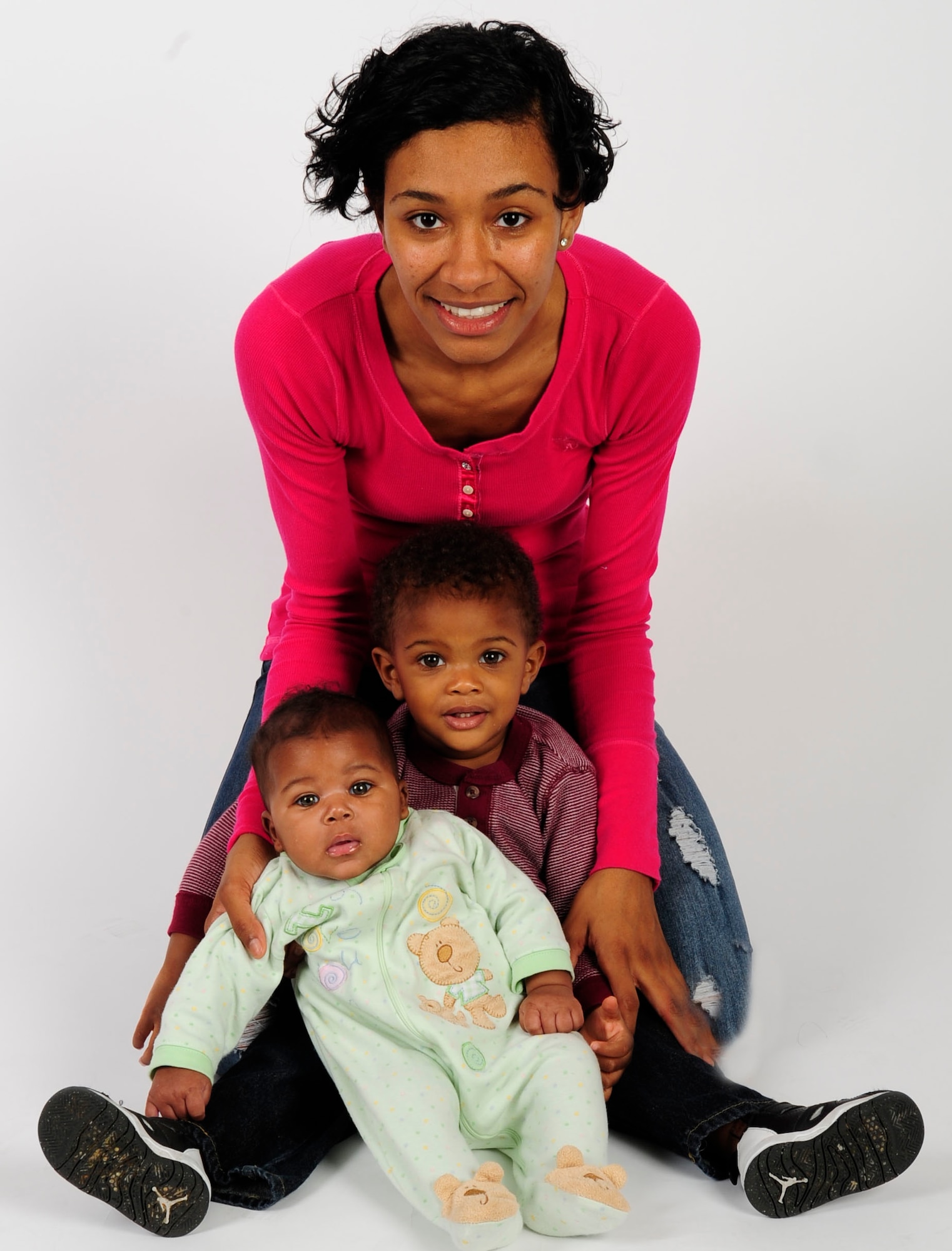 Jenay Randolph, mother of two, poses for a picture with her children Nov. 25, 2013 at MacDill Air Force Base, Fla. Randolph is the mother of two under the age of two that finds the balance between single motherhood and active-duty Air Force. The son, Jaylen Brown, is 17 months and the daughter, Jordyn, is four months.(U.S. Air Force photo by Senior Airman Shandresha Mitchell/Released) 