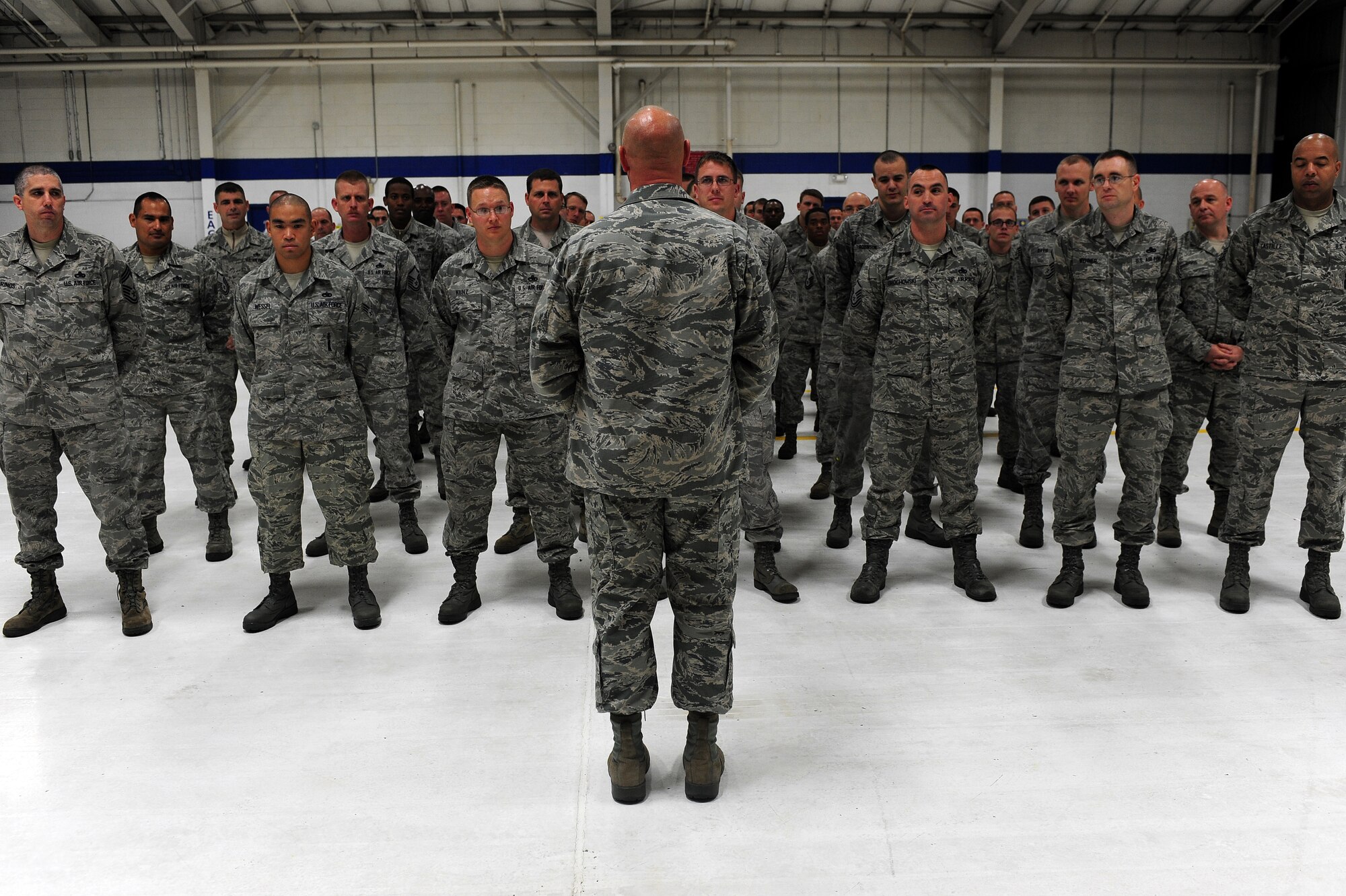 U.S. Air Force Chief Master Sgt. Scott Fuller, Ninth Air Force command chief, addresses members of the 4th Aircraft Maintenance Squadron during a visit to Seymour Johnson Air Force Base, N.C., Nov. 21, 2013. Fuller visited the base to familiarize himself with the 4th Fighter Wing’s mission and speak with Airmen about their quality of life. (U.S. Air Force photo by Airman 1st Class John Nieves Camacho)