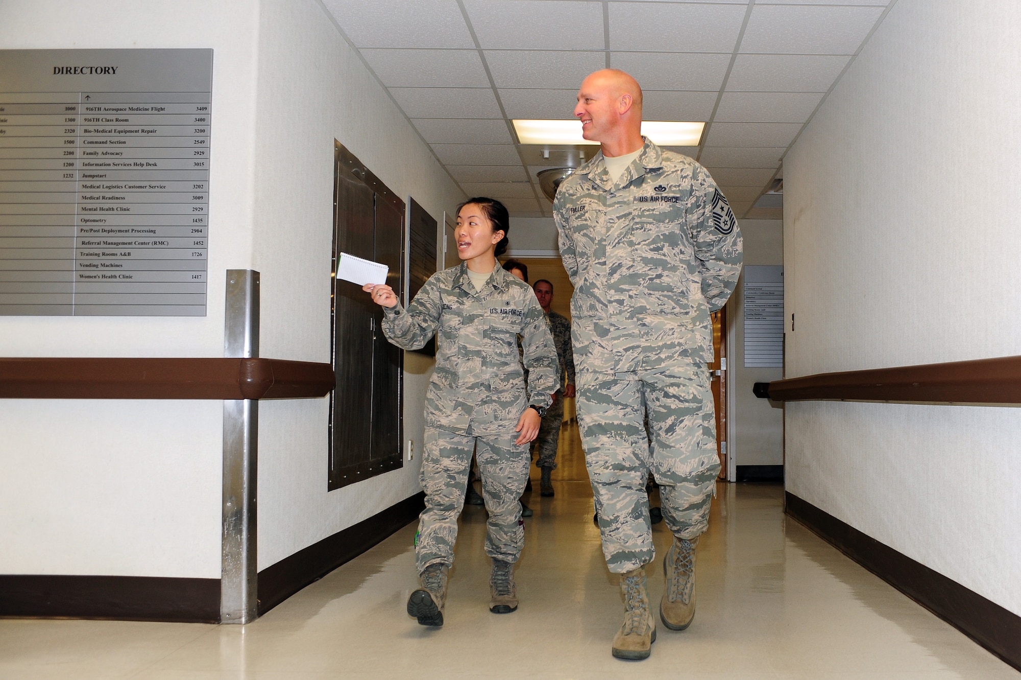 U.S. Air Force Chief Master Sgt. Scott Fuller, Ninth Air Force command chief, is led on a tour of the 4th Medical Group by Airman 1st Class A Xiong, 4th Aerospace Medicine Squadron public health technician, during a visit to Seymour Johnson Air Force Base, N.C., Nov. 21, 2013. Fuller toured several units during his visit, including the Airman Leadership School and 4th Aircraft Maintenance Squadron in addition to the medical group. (U.S. Air Force photo by Airman 1st Class John Nieves Camacho)