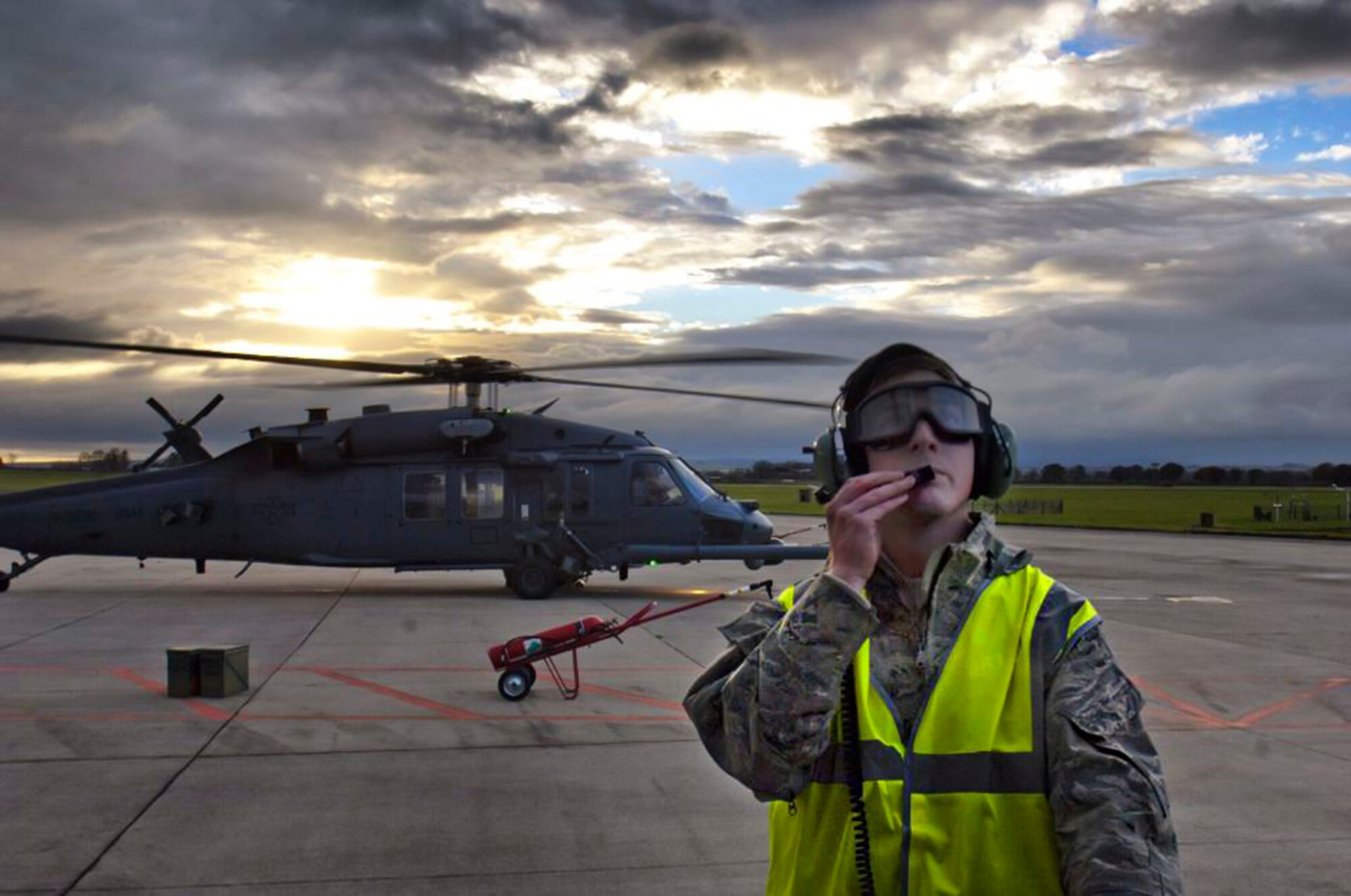 Senior Airman Clint Sheppard, 748th Aircraft Maintenance Squadron HH-60G crew chief, observes an HH-60G Pave Hawk’s rotors (not pictured),  as it taxis to a stop at Royal Air Force Leeming, England,  Nov. 21, 2013. The 748th AMXS supported the 56th Rescue Squadron during a week-long exercise, in which the pilots honed their skills against ground threats at the RAF Spadeadam test range.  (U.S. Air Force photo by 2nd Lt. Keenan Kunst/Released)