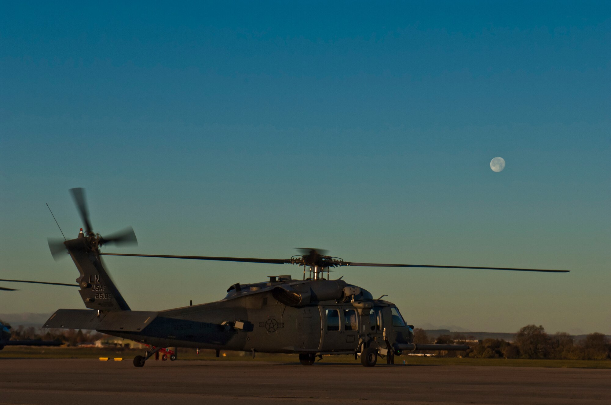 A 56th Rescue Squadron HH-60G Pave Hawk prepares for an early morning takeoff Nov. 19, 2013, at Royal Air Force Leeming, England. The 56th RQS flew to the RAF Spadeadam test range, where they had the opportunity to hone their skills engaging real ground threats and air defenses. The exercise took place Nov. 18-22, and involved both the 56th RQS and 748th Aircraft Maintenance Squadron. (U.S. Air Force photo by 2nd Lt. Keenan Kunst/Released)