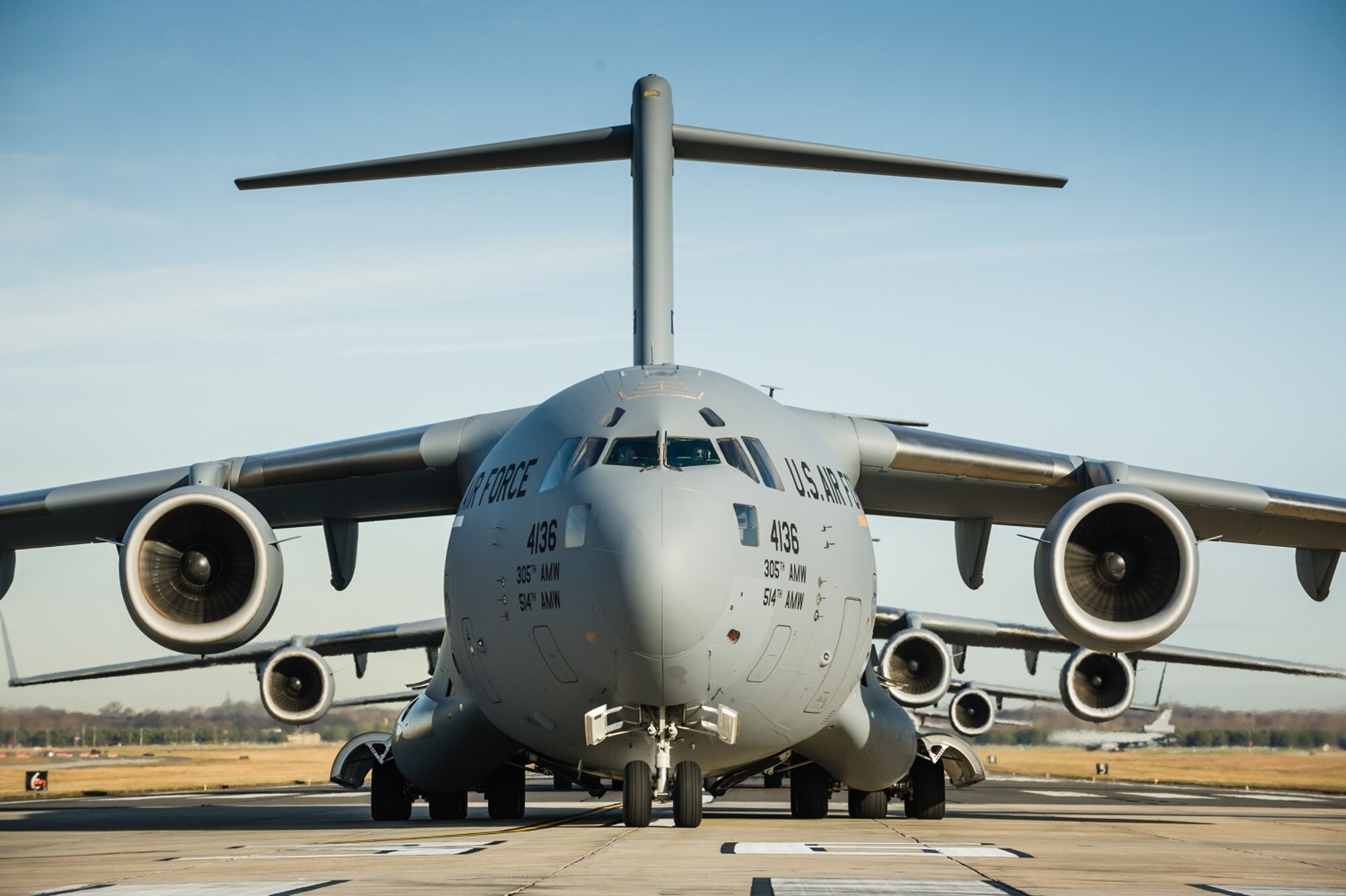 An "Elephant Walk," comprising 12 KC-10 Extenders and six C-17 Globemaster IIIs from the 305th Air Mobility Wing, was held Nov. 21, 2013, as part of a training exercise at Joint Base McGuire-Dix-Lakehurst, N.J.  The exercise enabled aircrew, maintenance, command post and operational support personnel to test their ability to launch a mass amount of aircraft in support of real-world operations. An Elephant Walk is a nose-to-tail taxi formation. (u.S. Air Force photo by Russ Meseroll/Released)