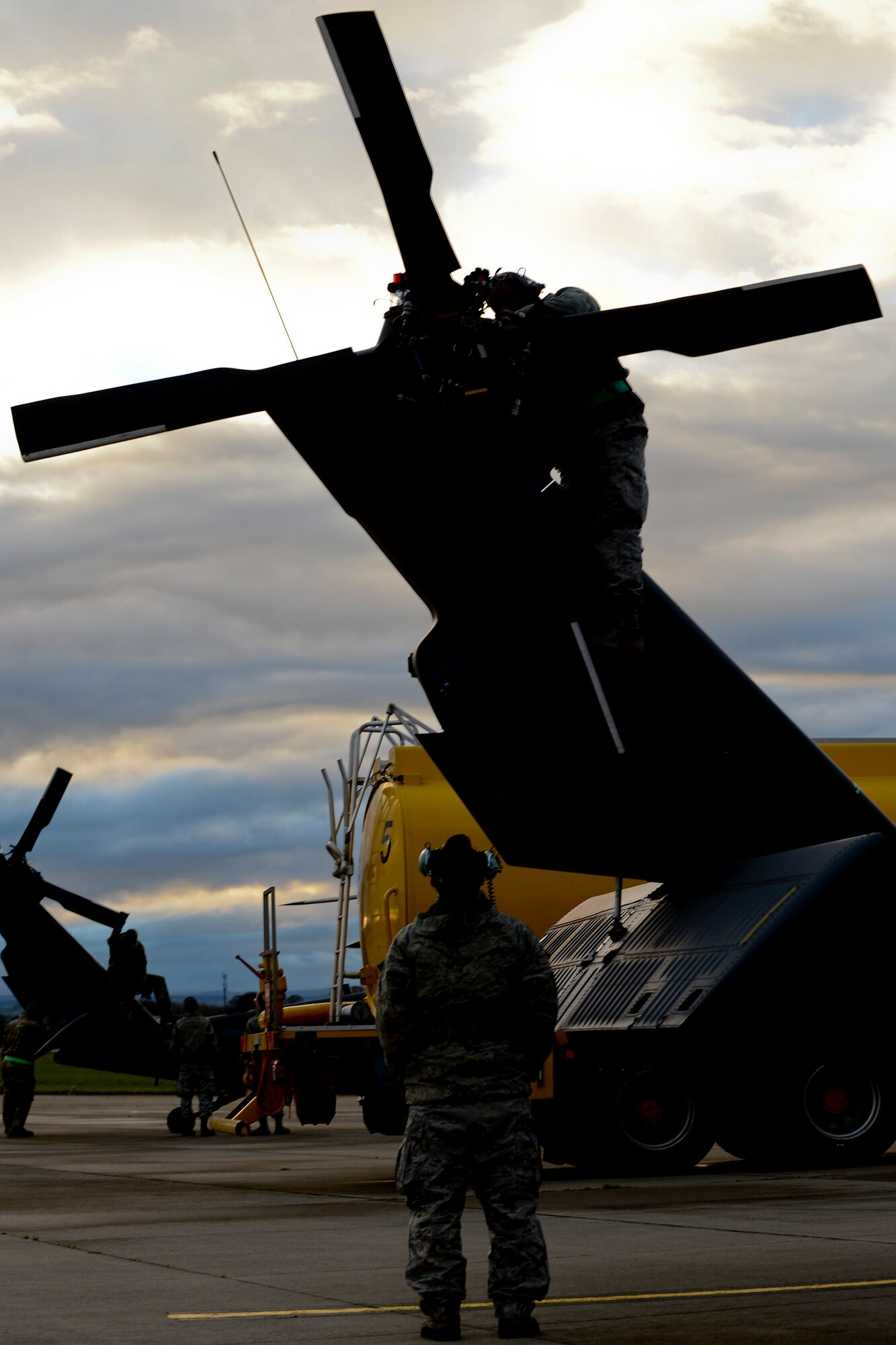 Airmen assigned to the 748th Aircraft Maintenance Squadron perform maintenance on an HH-60G Pave Hawk at Royal Air Force Leeming, England, Nov. 18, 2013. The 56th Rescue Squadron and 748th AMXS participated in electronic warfare training over the RAF Spadeadam test range Nov. 18-22. Throughout the week, they honed their skills engaging potential threats. (U.S. Air Force photo by Airman 1st Class Trevor T. McBride/Released)