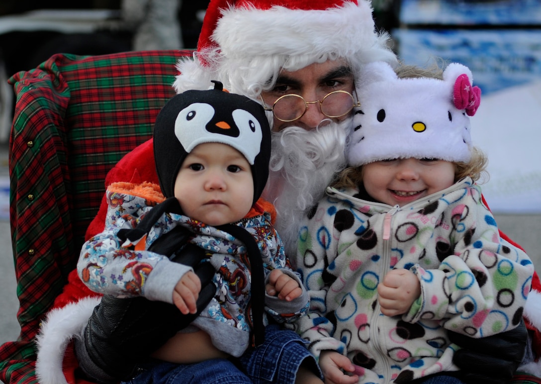 Children take photos with Santa Claus during the celebration of the arrival of the Capitol Christmas tree at Joint Base Andrews, Md., Nov. 24, 2013. The tree traveled more than 5,000 and stopped in 22 different communities. The U.S. Capitol Christmas Tree will be lit by Speaker of the House John A. Boehner during a ceremony on Dec. 3 on the Capitol’s West Front lawn at 5 p.m. This year’s tree is an Engelmann spruce from the Newport Ranger District of the Colville National Forest in Washington State. (U.S. Air Force photo/Airman 1st Class Nesha Humes)