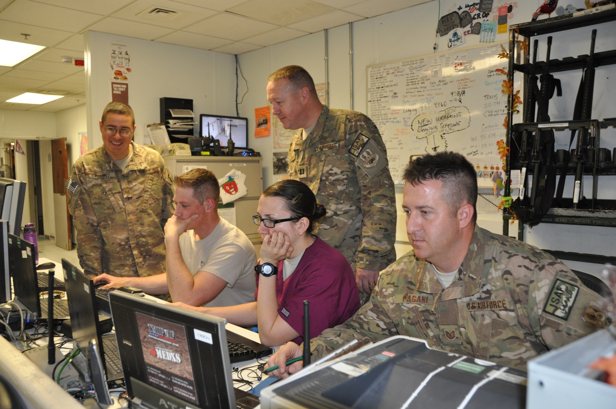 U.S. Air Force Chaplain (Capt.) Gary Willeford, 455th Air Expeditionary Wing, and Tech. Sgt. Brian Ramirez, 455 AEW chaplain assistant, check in with the emergency room personnel at Heathe N. Craig Joint Theater Hospital at Bagram Airfield, Afghanistan Nov. 22, 2013. Religious support teams provide their services to Airmen throughout Bagram. (U.S. Air Force Photo by Tech. Sgt. Rob Hazelett)