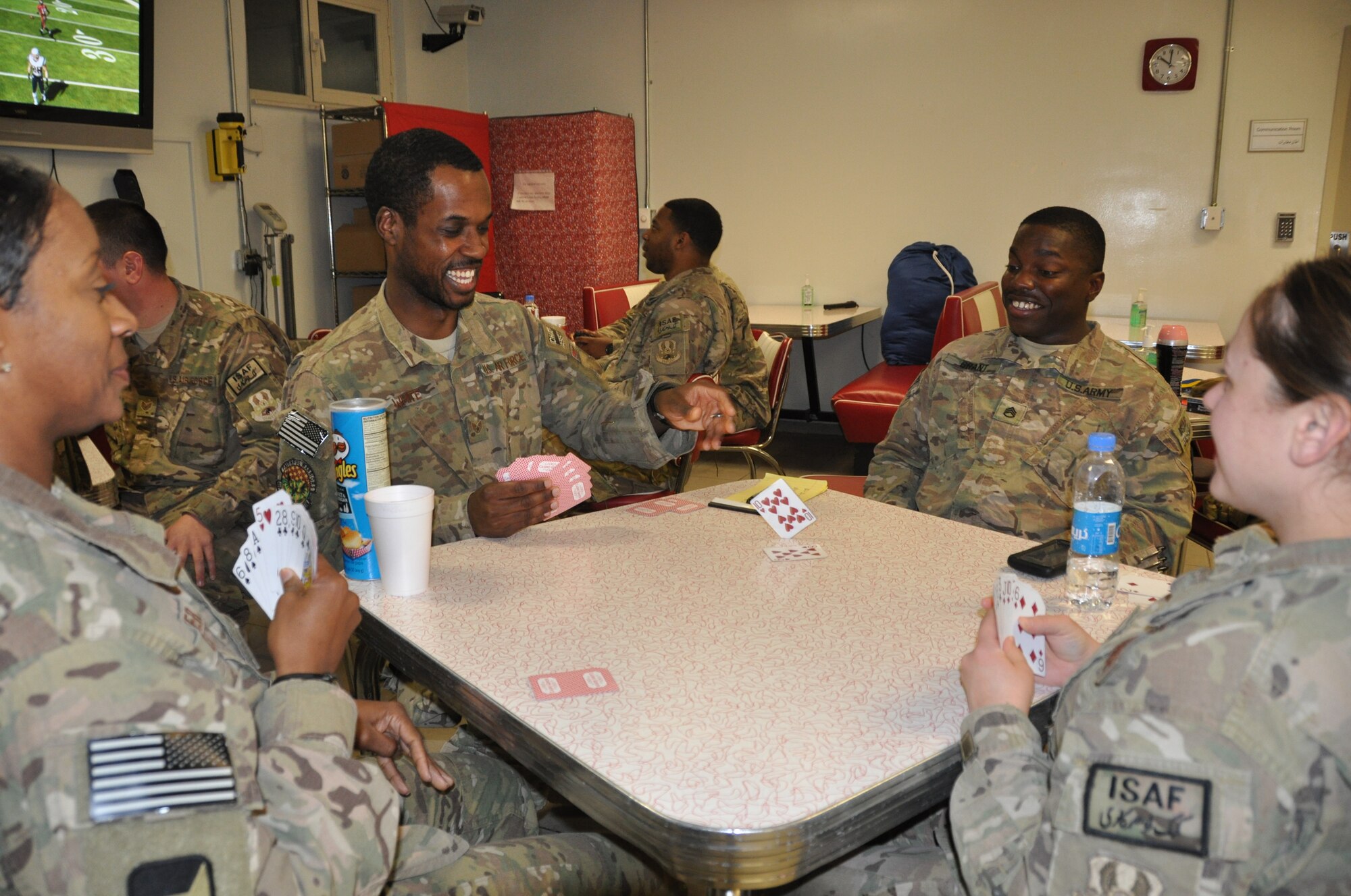 U.S. Air Force Staff Sgt. Charles White, 455th Air Expeditionary Wing chaplain assistant, plays a game of cards with his colleagues during a break at Heathe N. Craig Joint Theater Hospital at Bagram Airfield, Afghanistan Nov. 22, 2013. Religious support teams provide their services to Airmen throughout Bagram. (U.S. Air Force Photo by Tech. Sgt. Rob Hazelett)