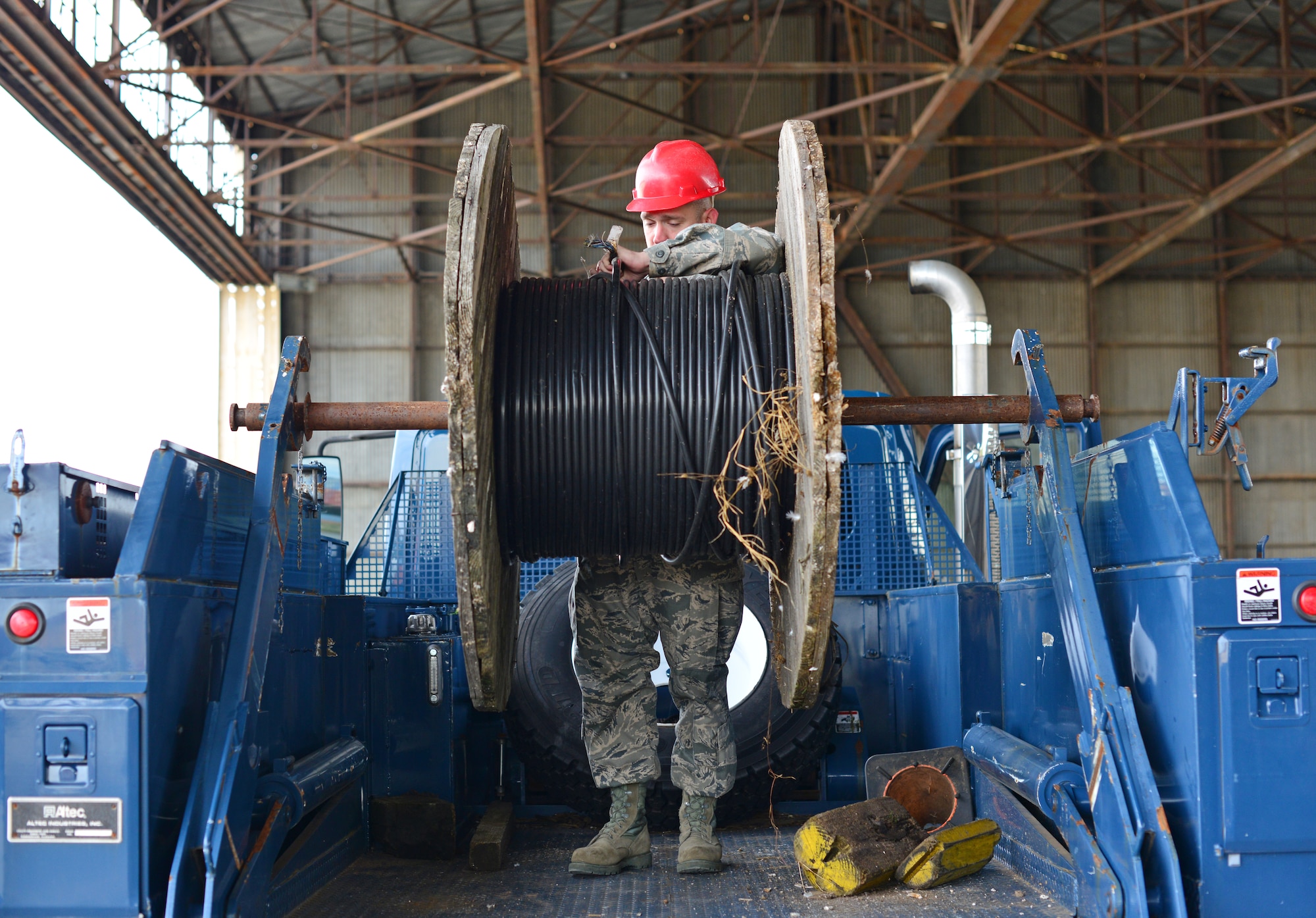 Staff Sgt. Scott Gingrich, 31st Communications Squadron cable and maintenance supervisor, prepares to tie off a reel of cable, Nov. 13, at Aviano Air Base, Italy. Cable and antenna maintainers are responsible for maintaining Aviano's communication infrastructure. (U.S. Air Force photo/Senior Airman Briana Jones)
