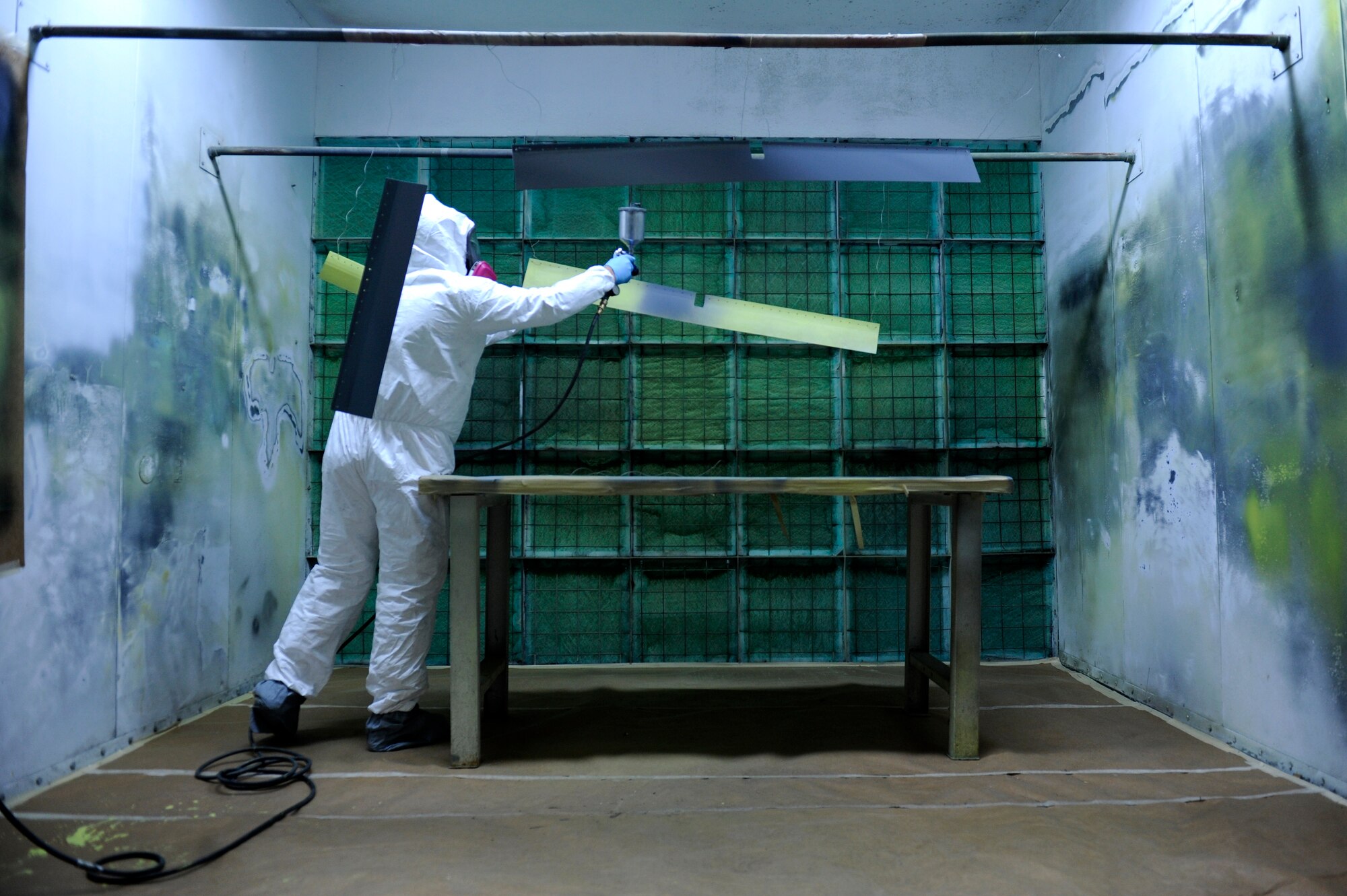 U.S. Air Force Staff Sgt. Jordan Smith, 18th Equipment Maintenance Squadron aircraft structural maintenance technician who hails from Lawton, Mich., spray paints aircraft parts on Kadena Air Base, Japan, Nov. 21, 2013. Whether it's replacing a $3 bolt or repairing a $1.5 million KC-135 Stratotanker aileron, the Aircraft Structural Maintenance flight gives the U.S. Air Force an unmatched reach and presence in the Asia Pacific Region and is vital to the successful mission of the 18th Wing. (U.S. Air Force photo by Senior Airman Maeson L. Elleman)