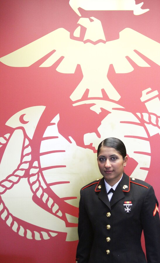 U.S. Marine Corps Pfc. Aseel Salman, currently one of the only Iraqi-born female Marines, poses for a photo at a Recruiting Station Frederick, Md., office. Salman graduated from Marine Corps Recruit Training Nov. 15, 2013. She is scheduled to depart for Camp Geiger N.C. in two weeks for combat training followed by her military occupational school for aviation electronics. (U.S. Marine Corps photo by Sgt. Amber Williams/Released)