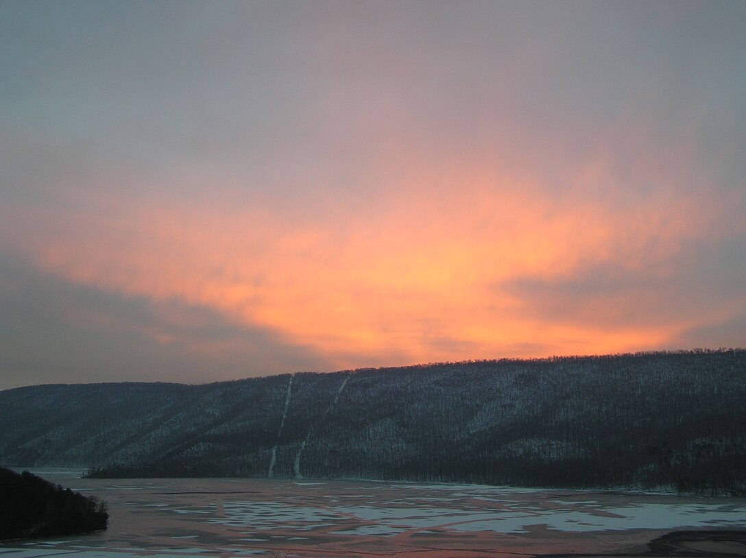 The sun rises over Raystown Lake in this view from the Visitor Center in Seven Points.