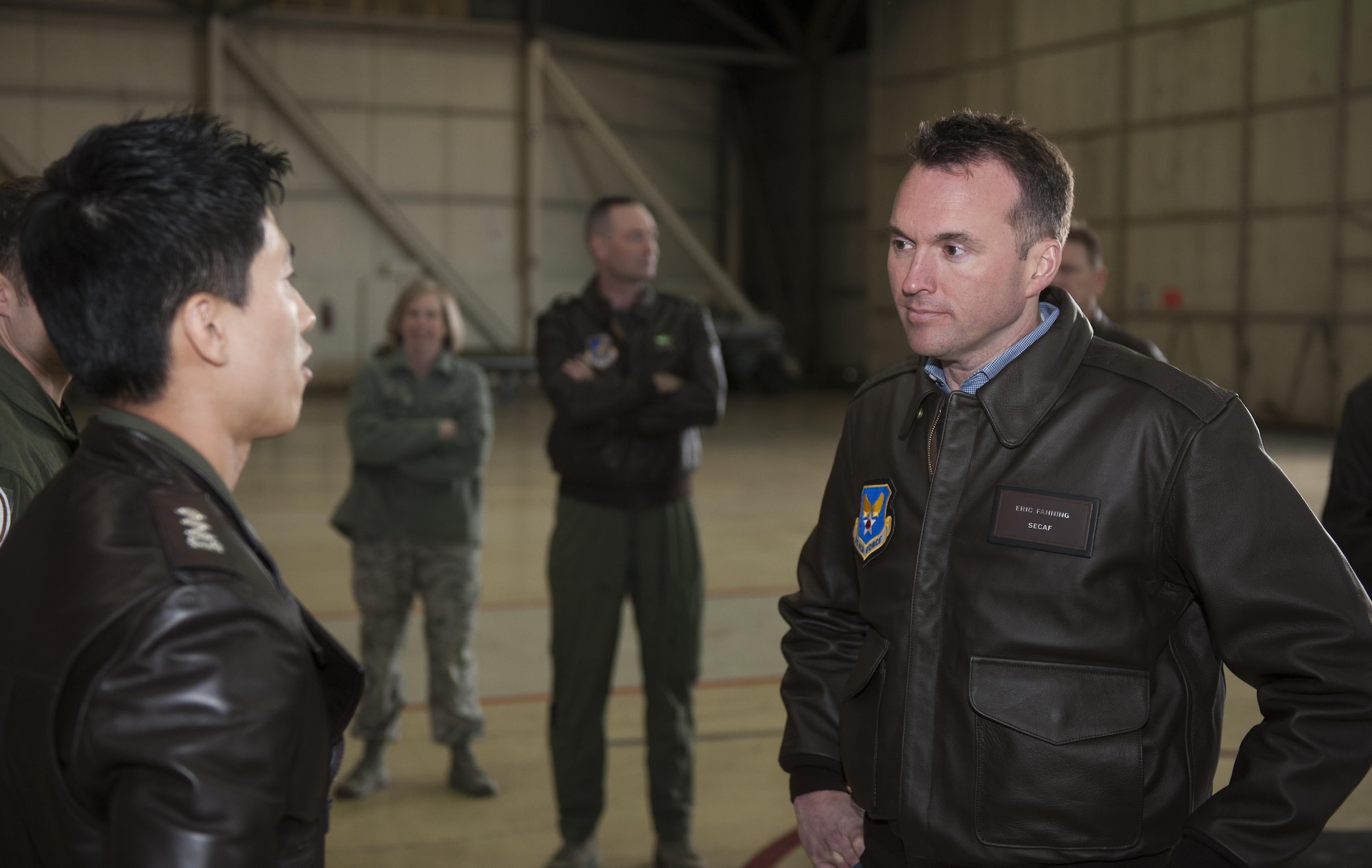 Acting Secretary of the Air Force Eric K. Fanning listens to a Republic of Korea air force Airman Nov. 26, 2013, as he explains the U.S. and ROK partnership at Kunsan Air Base, South Korea. The secretary visited the Wolf Pack to get a better look at Kunsan AB’s mission of defending the base, accepting follow-on forces and taking the fight North.