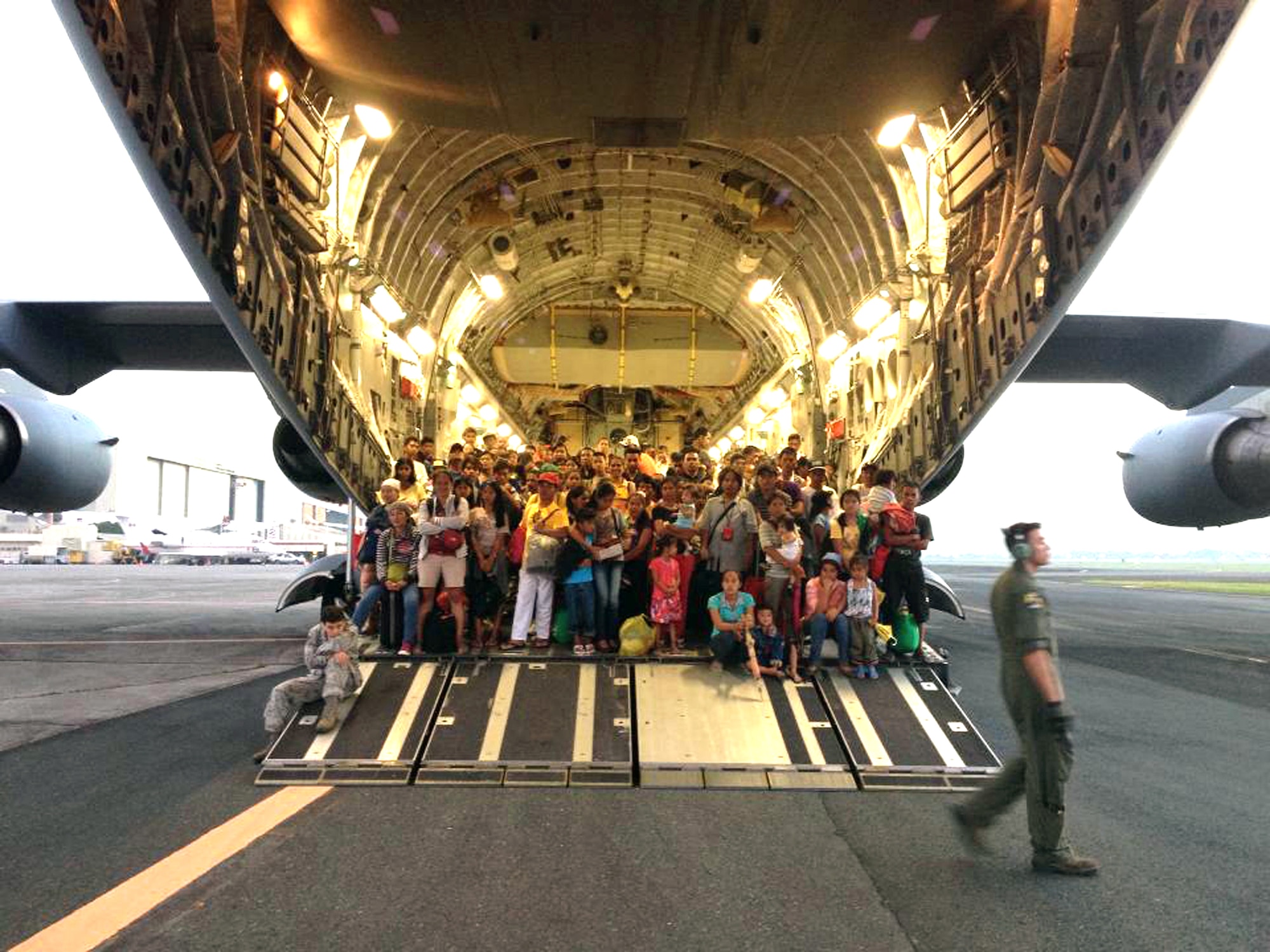 Active-duty Airmen from the 517th Airlift Squadron and Alaska Air Guard members from the 249th Squadron are currently serving in Operation Damayan, storm relief work in the Philippines. Photo shows some of the refugees transported to safety. (U.S. Air Guard photo courtesy/Master Sgt. Brian Johnson) 